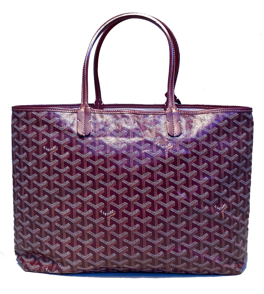 Goyard Purple Monogram St. Louis PM Tote in excellent condition. Classic St Louis style with signature monogram canvas exterior in purple with matching leather trim. Top snap closure opens to a beige canvas interior with plenty of storage space for