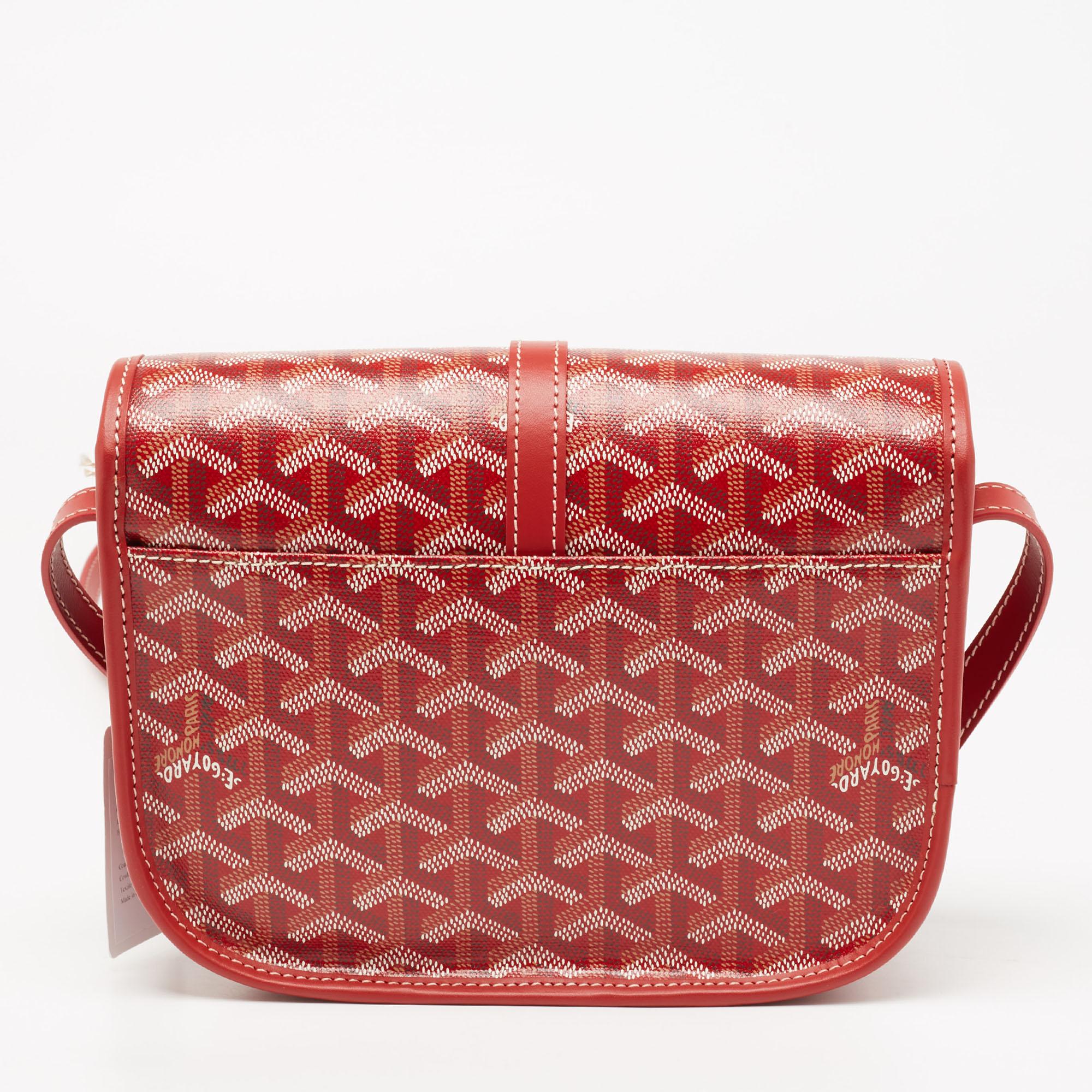 This Goyard Belvedere bag brings a smart design! Crafted in Goyardine canvas & leather, the bag features an iconic look, an adjustable leather strap, and silver-tone hardware. Lined in canvas, the red bag opens to a spacious interior to keep all