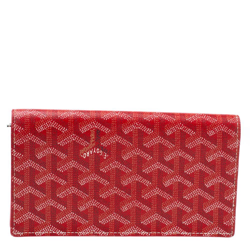 This wallet from Goyard brings along a touch of luxury and immense style. It comes crafted from coated Goyardine canvas and equipped with compartments and multiple slots just so you can neatly carry your cards and cash.

Includes: Original Box,