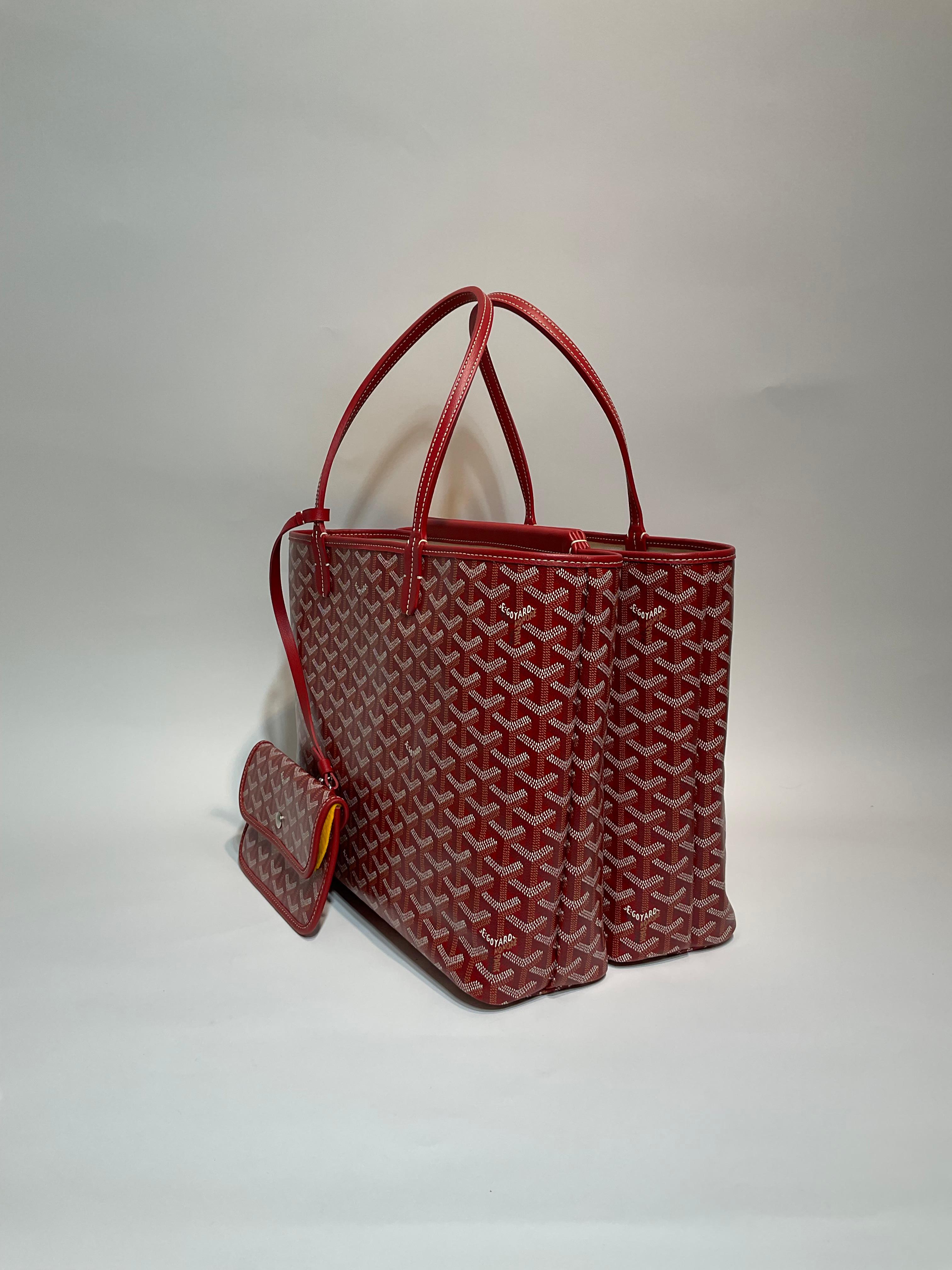 Goyard Red Isabelle PM Tote- Pristine; appears never carried. 
Goyard Red Goyardine chevron patterned coated canvas tote is roomier than the Saint Louis PM.  With two large separate compartments and a central magnetic secure pocket, the Isabelle is