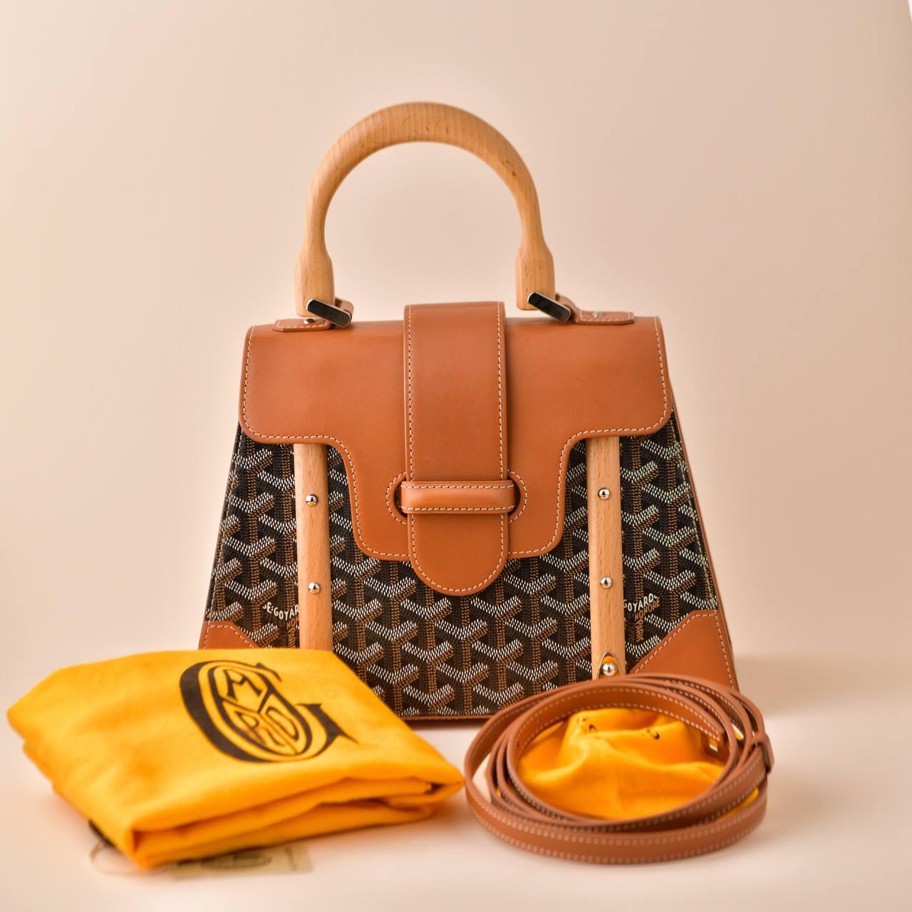 SKU	33301313
Comes With	Goyard Dust Bag, Shoulder strap and Dandelion Authenticity Guarantee Only
Model	Saigon PM
Serial Number	MB*******
Metal	Stainless steel
Materials	Canvas, Calfskin
Condition	Excellent
Other Info	Approximate dimensions: 28cm x