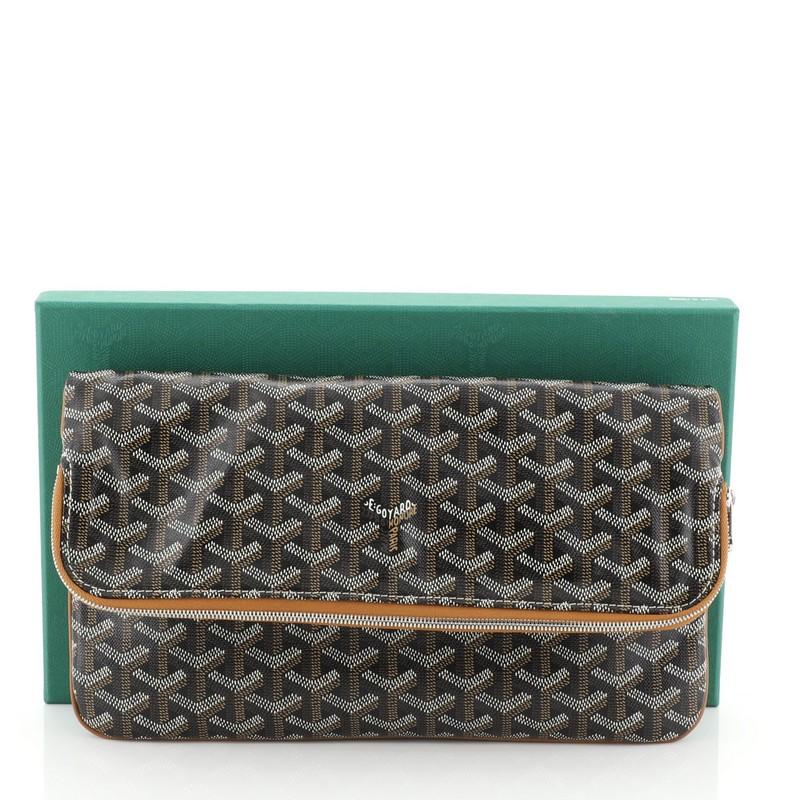 This Goyard Saint Marie Clutch Coated Canvas, crafted from brown chevron coated canvas, features exterior back slip pocket, concealed interior zip compartment at flap, leather trim and silver-tone hardware. Its front flap and zip closure opens to a