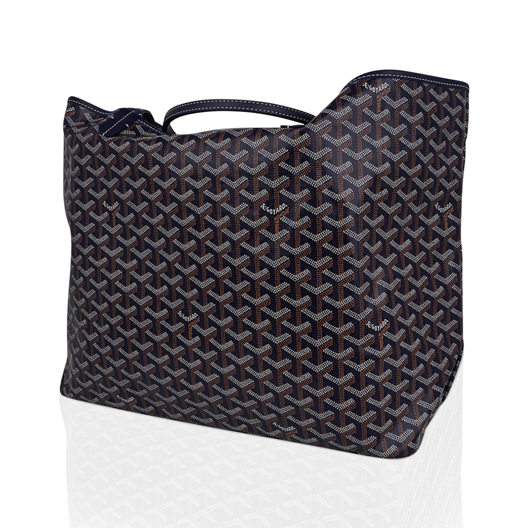 Mightychic offers a Goyard Blue signature GM Saint Louis tote with coated canvas chevron print and calfskin leather trim.
Light weight and spacious this has become a favorite from celebrities to busy moms.
Flat handles are long enough to carry over