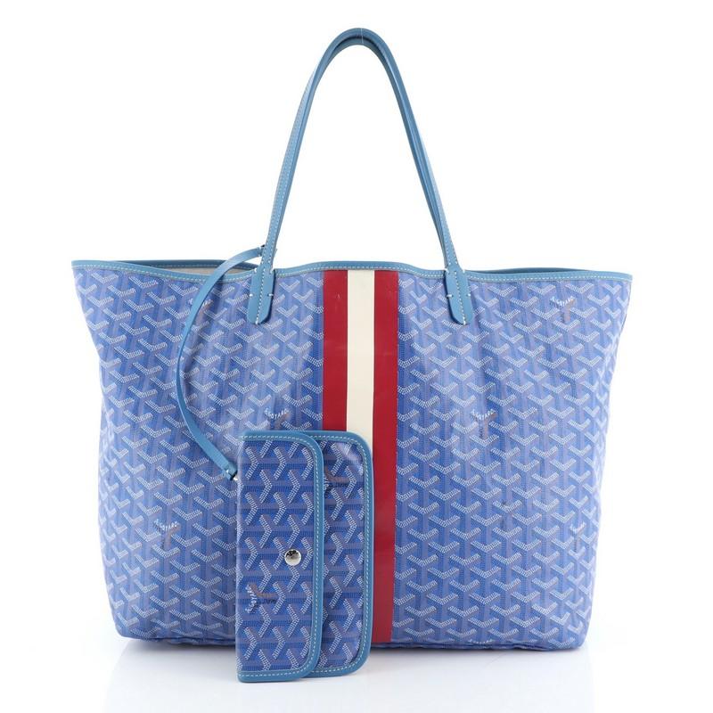 This Goyard St. Louis Tote Coated Canvas GM, crafted from blue coated canvas, features dual slim leather handles, leather trim, and silver-tone hardware. Its wide open top showcases a neutral fabric interior.  

Condition: Fair. Odor in interior.