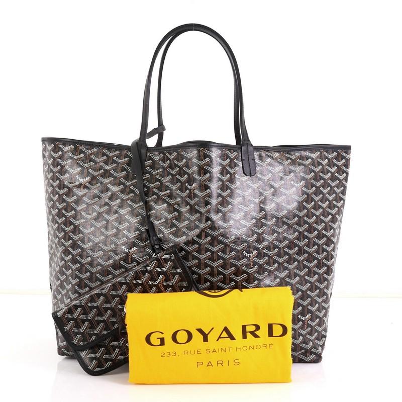 This Goyard St. Louis Tote Coated Canvas GM, crafted from brown coated canvas, features dual slim leather handles, leather trim and silver-tone hardware. Its wide open top showcases a neutral fabric and canvas interior.

Condition: Excellent.