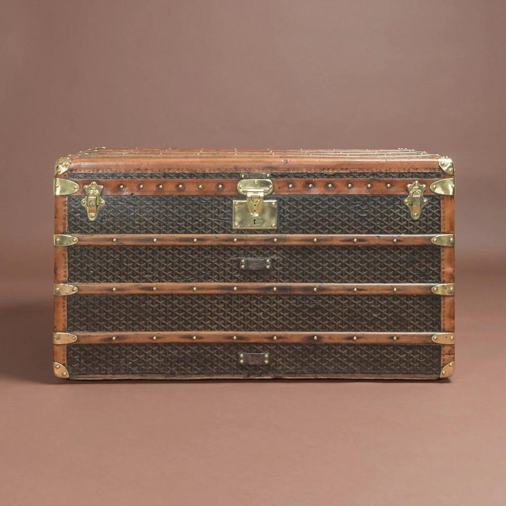 Splendid steamer trunk by Goyard in their signature 'Goyardine' chevron pattern canvas covering with polished brass lock, catches & handles; circa 1915. The interior of this trunk has been re-lined to be similar to the original.

Dimensions: 100