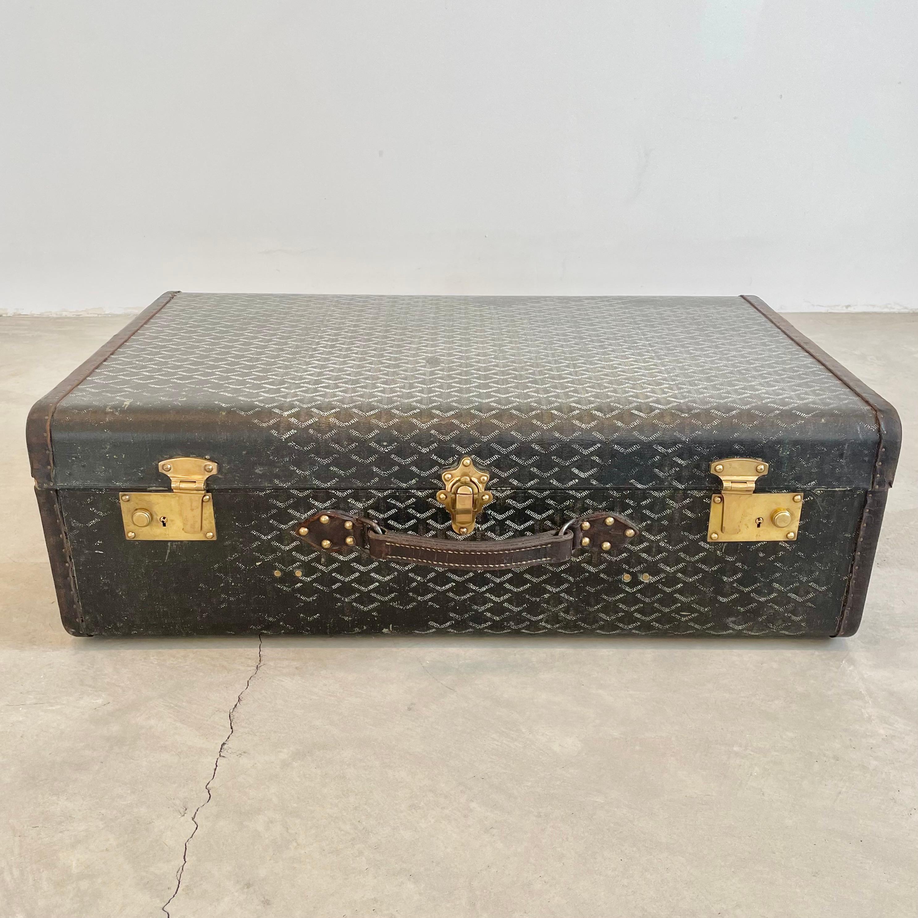 Classic vintage Goyard trunk. Wooden frame wrapped in the iconic Goyard canvas print with saddle leather and brass hardware. Incredible patina and coloring to leather and canvas. Timeless simplicity in design and iconic badging have made this brand