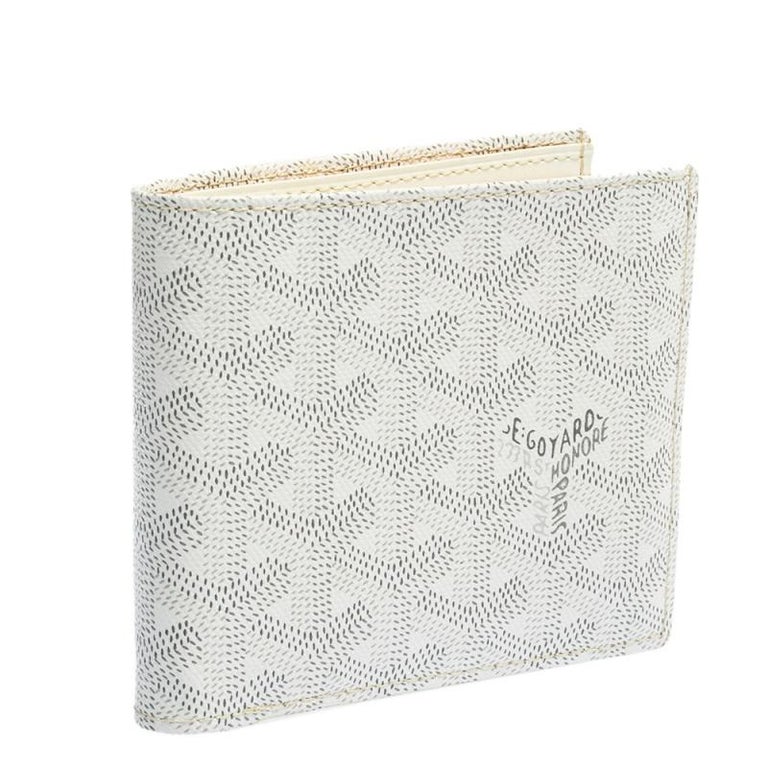 GOYARD. Large wallet in white and brown Goyardine coated…