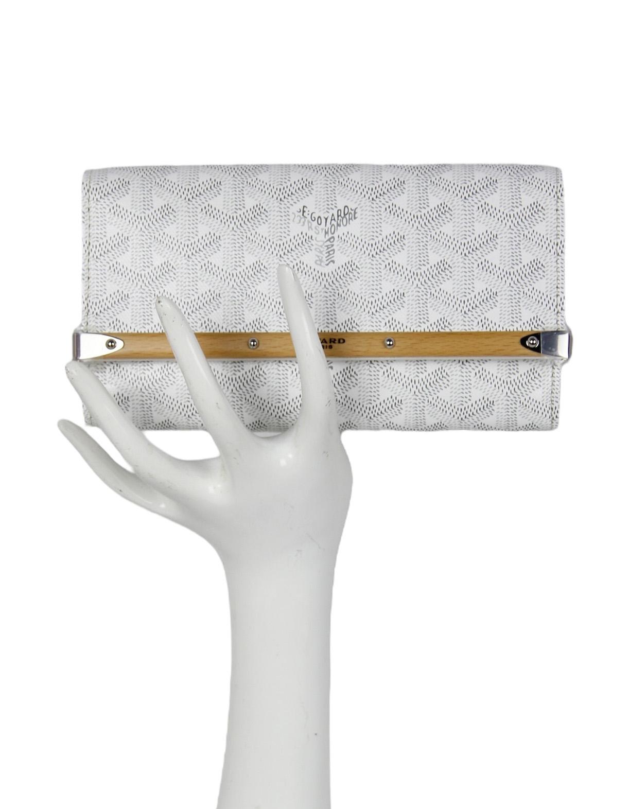 Goyard White Goyardine Monte Carlo Mini Case Wallet. Designed as a case, it can be worn on a belt, with its two leather loops. It can also be worn across the chest with an additional PM strap. 

Made In: France
Color: White
Hardware:
