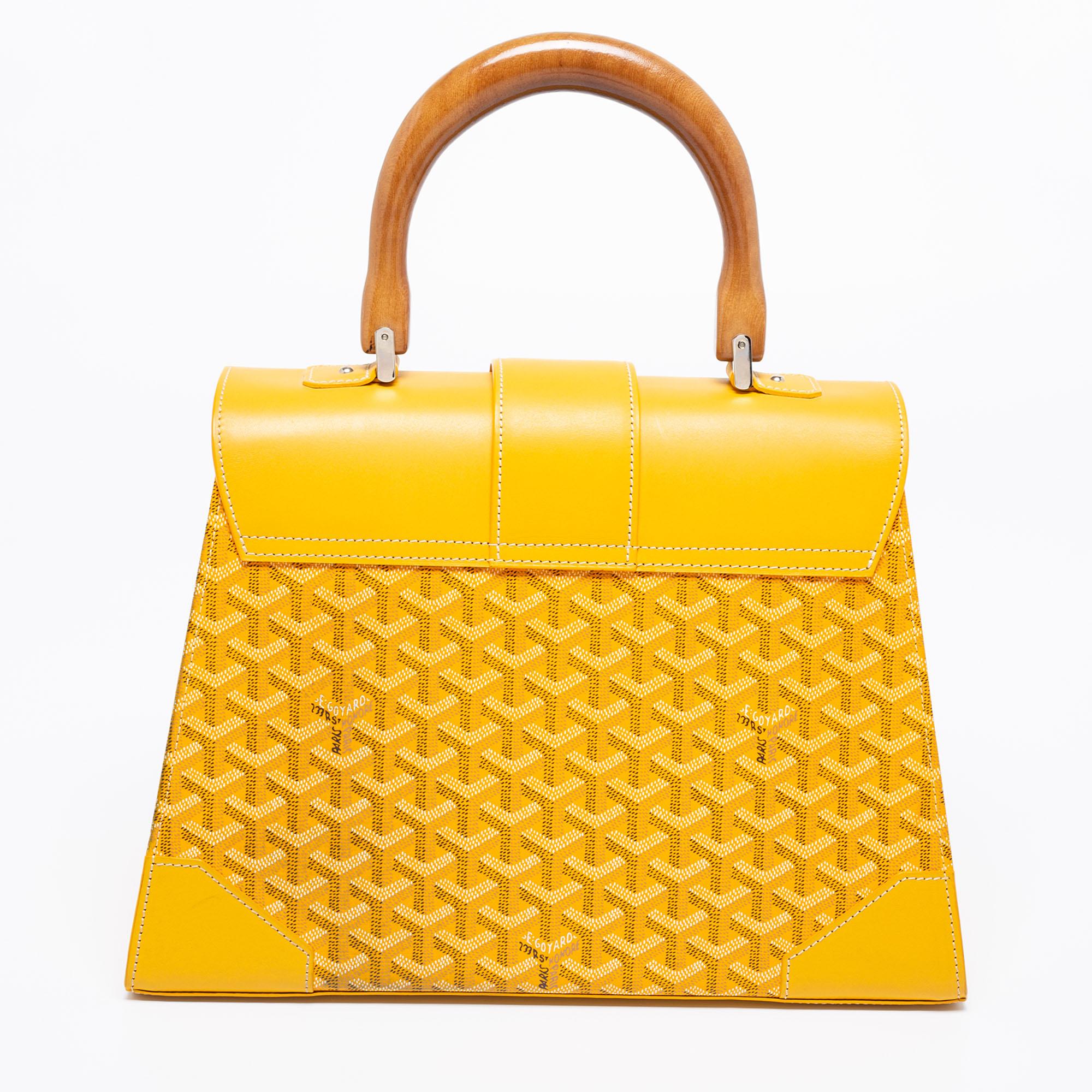 This handbag from Goyard will be a timeless addition to your closet. Crafted from the brand's signature Goyardine canvas and leather, this bag has a fold-in lock on the flap. While the shape and detailing elevate its beauty, the lined interior will