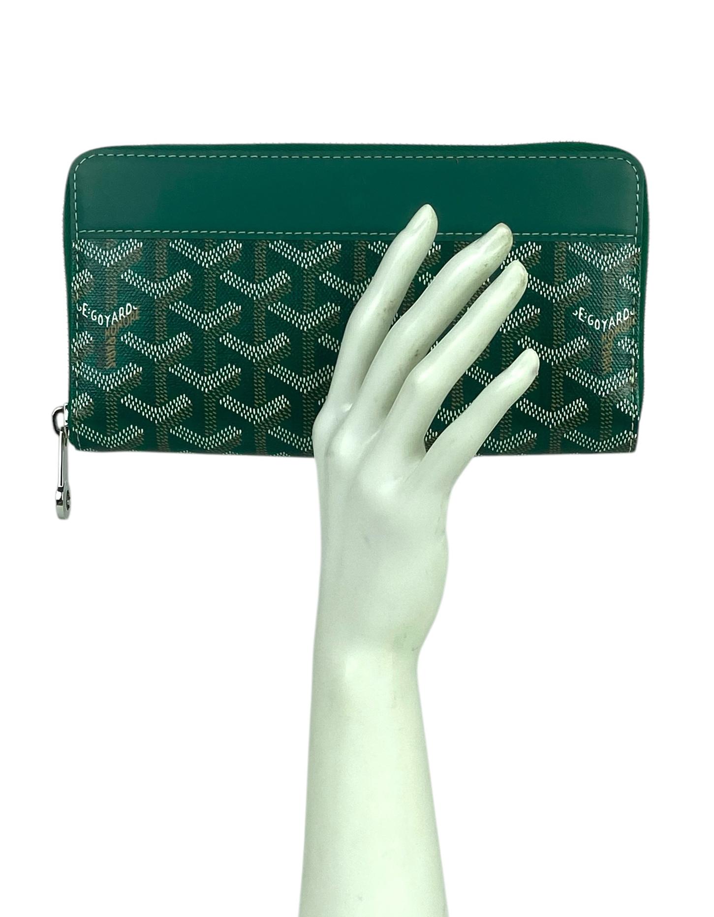 Goyardine Green Goyardine Matignon Zip Around GM Wallet

Color: Green
Materials: Goyardine canvas & vauzelles calfskin
Interior: Green Nièvre Goatskin Lining 
Compartments:12 card slots, 2 large flat pockets, compartments, secure change