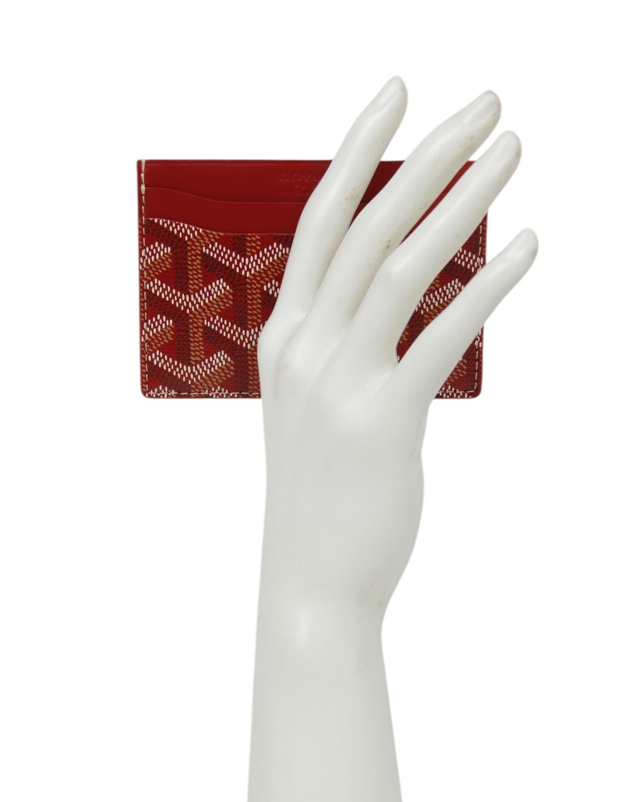 Goyardine Red Goyardine Canvas Saint Sulpice Card Holder

Color: Red
Materials: Canvas and leather 
Four credit card slots and middle card/compartment slot
Overall Condition: Excellent

Measurements:
4.25