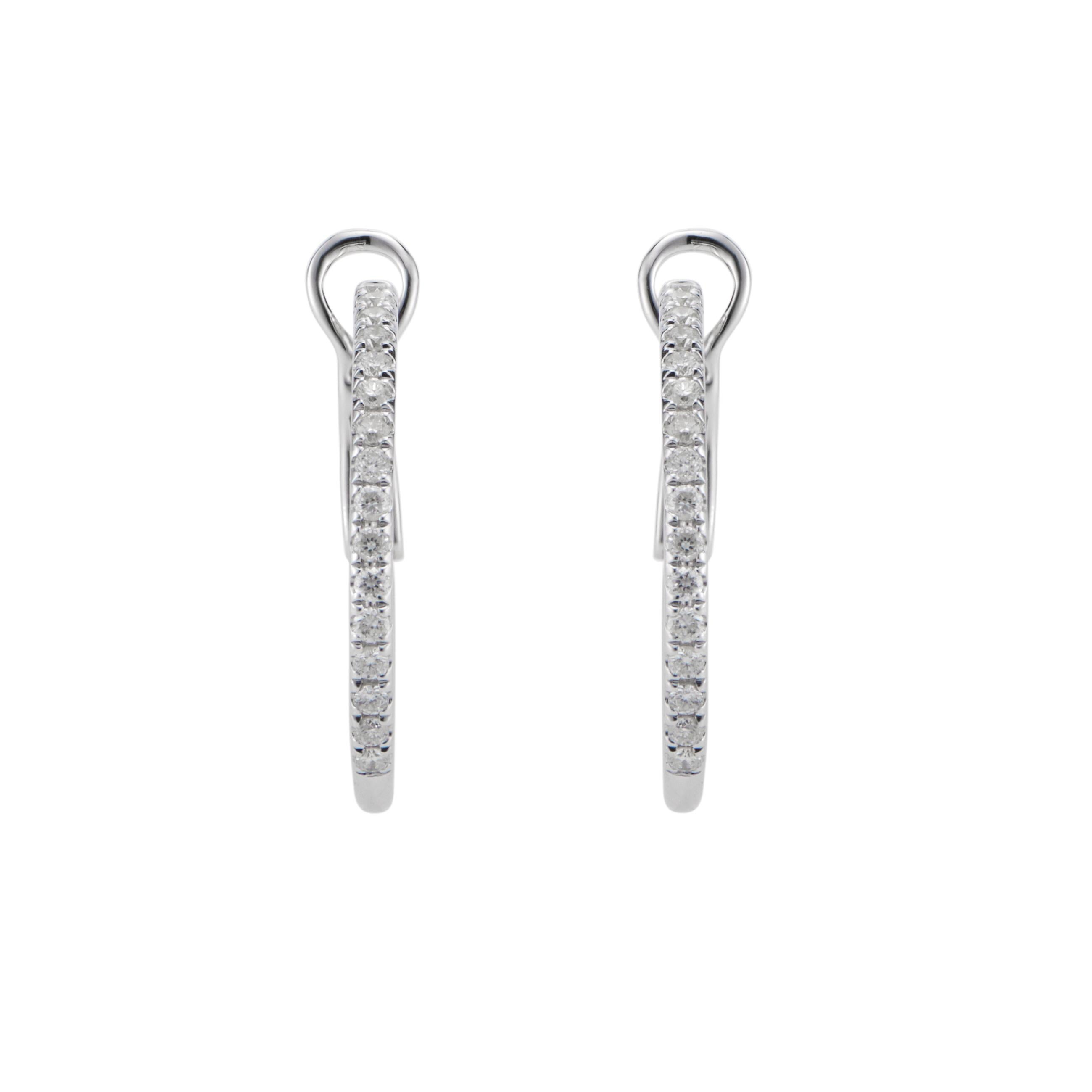 Designer GP clip post hoop earrings with 32 bright white diamonds in 14k white gold. 

32 round full cut diamonds, approx. total weight .30cts, G, VS2
14k white gold 
Stamped: 14k 585
Tested: 14k
Hallmark: GP
2.6 grams
Top to bottom: 19.10mm or .75