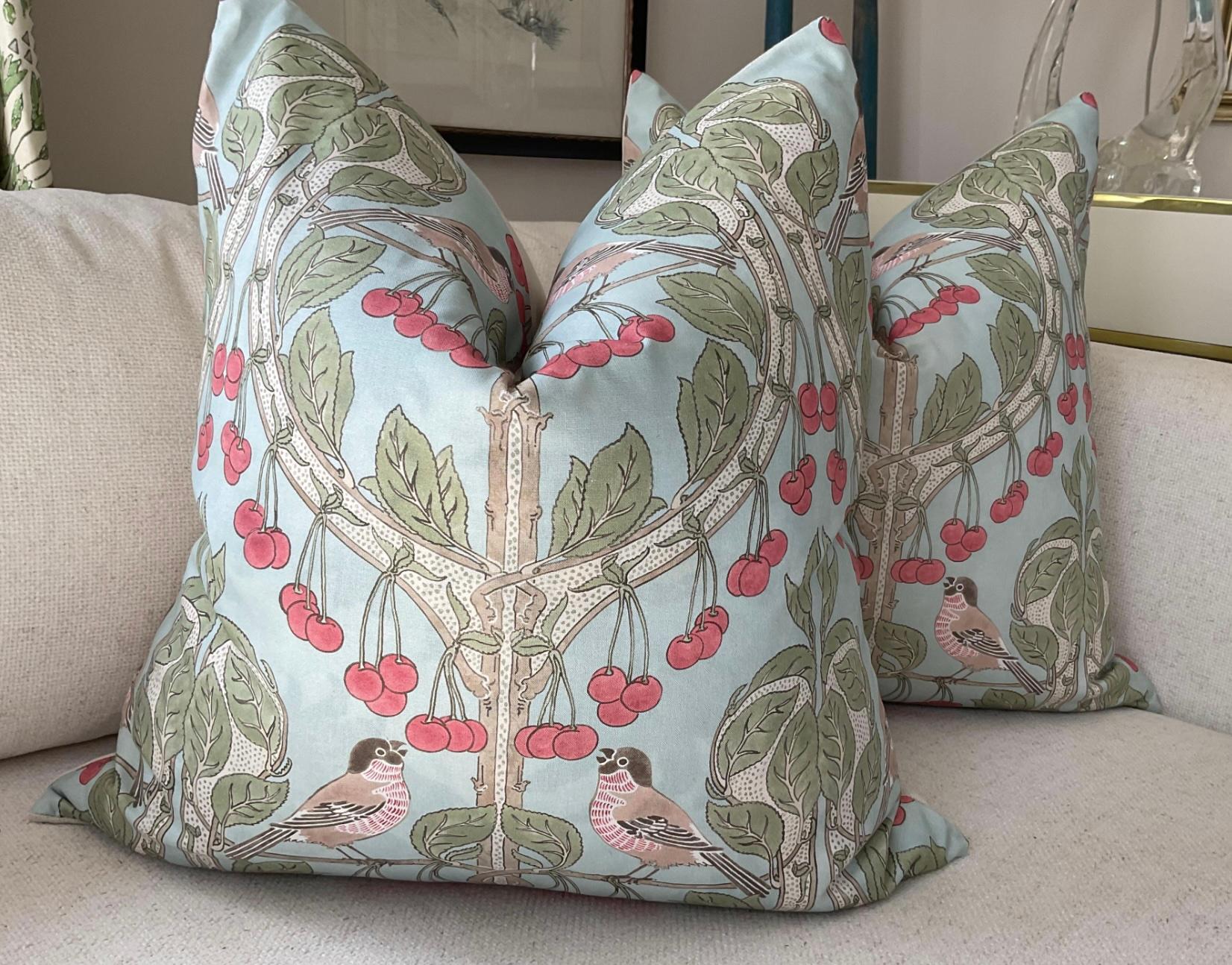 This offering is for a pair (2) of 22” generous down-filled pillows. These beautiful pillows will feature Birds and Cherries by inimitable GP and J Baker in soft blue on the front with coordinating off-white linen back. Closure is by way of an