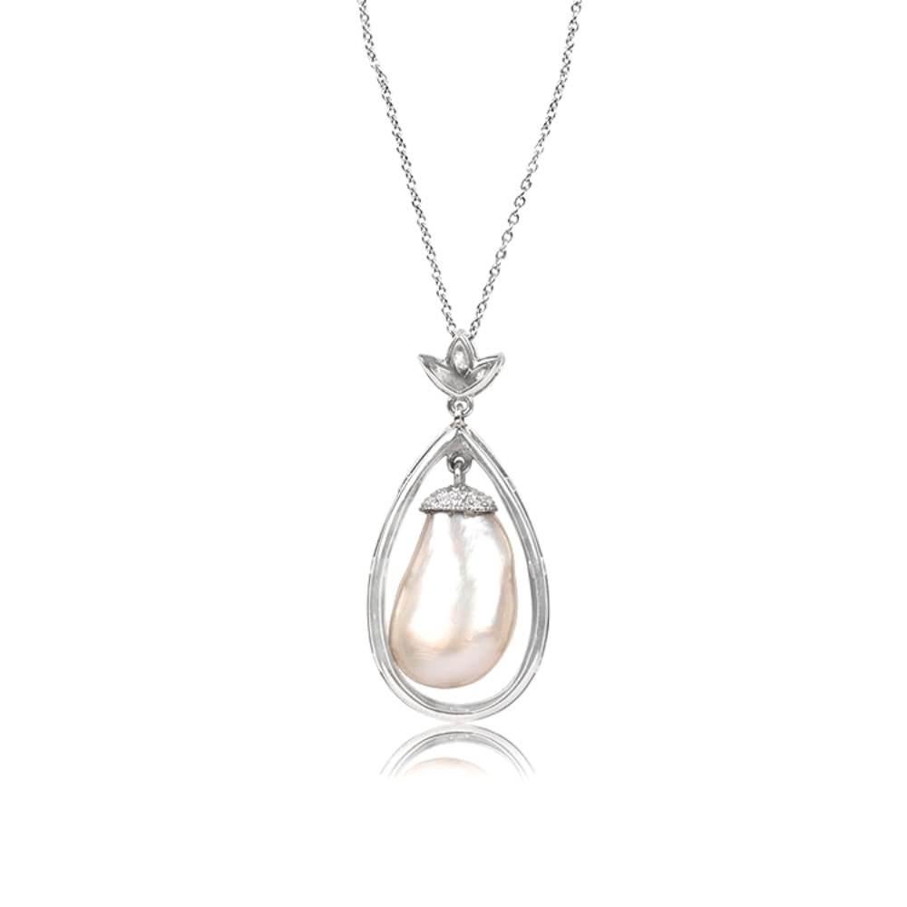Introducing a stunning platinum necklace with a touch of elegance. This exquisite piece showcases a captivating 13.52-carat pearl drop pendant, certified by the esteemed G&P LAB. Suspended gracefully, the pearl delicately sways within a pear-shaped