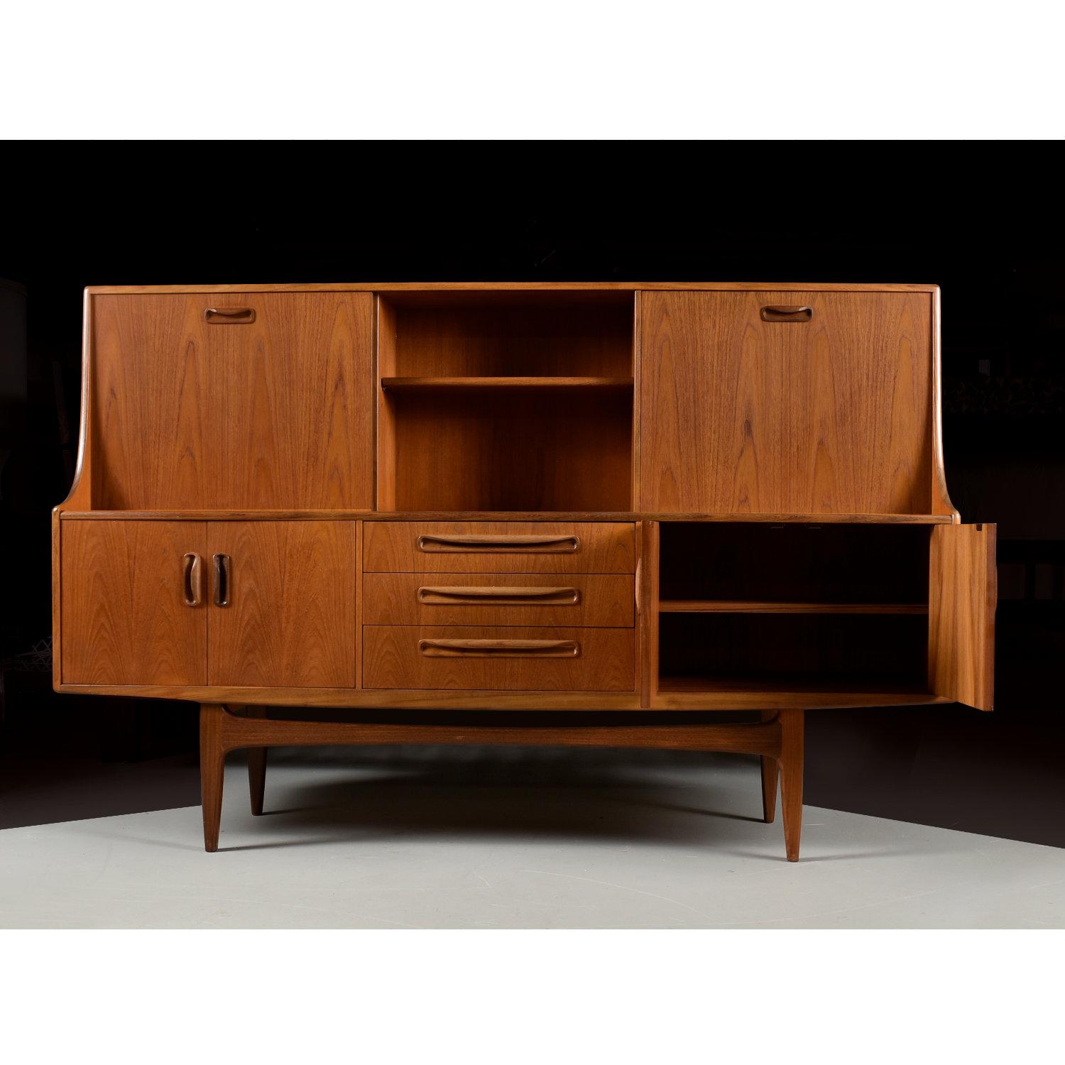 Stunning Mid-Century Modern teak hutch by UK producer, G-Plan. The Danish Modern style sideboard looks Scandinavian but was actually made in the United Kingdom. The cabinet still bear’s the maker’s mark on the backside of one of the doors. This