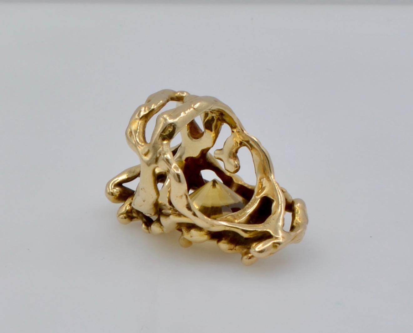 This amazing organic ring was designed and made by the Monterey, California Designer Dorian Graboswki. The 7.25 ct citrine is set in 14k gold freeform branches that intertwine with three dimensional movement . The many tendrils of the beaches