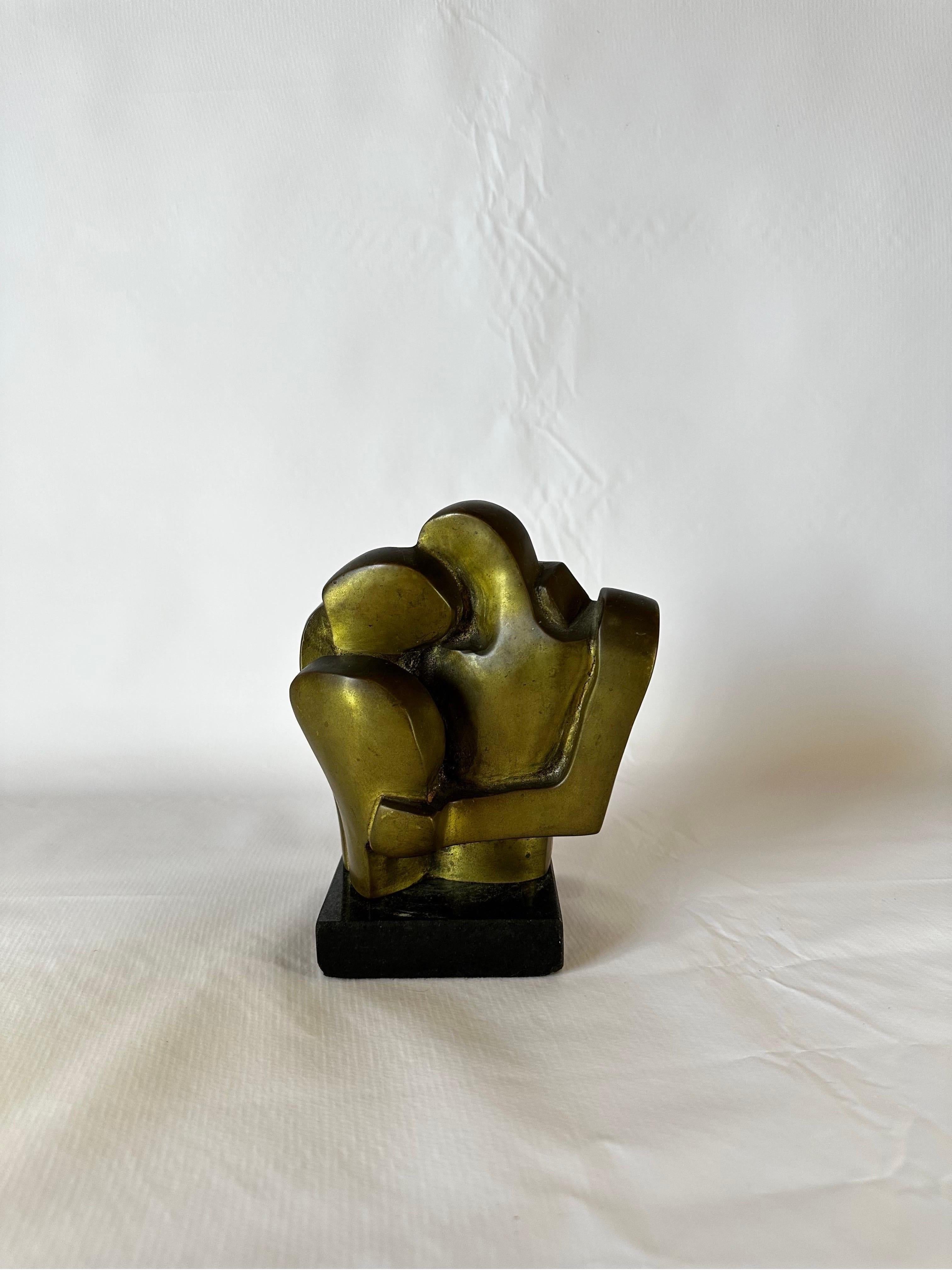 Brazilian midcentury figurative bronze sculpture on granite base of two people embracing one another. Signed by artist Graça Baião and numbered 6/30.