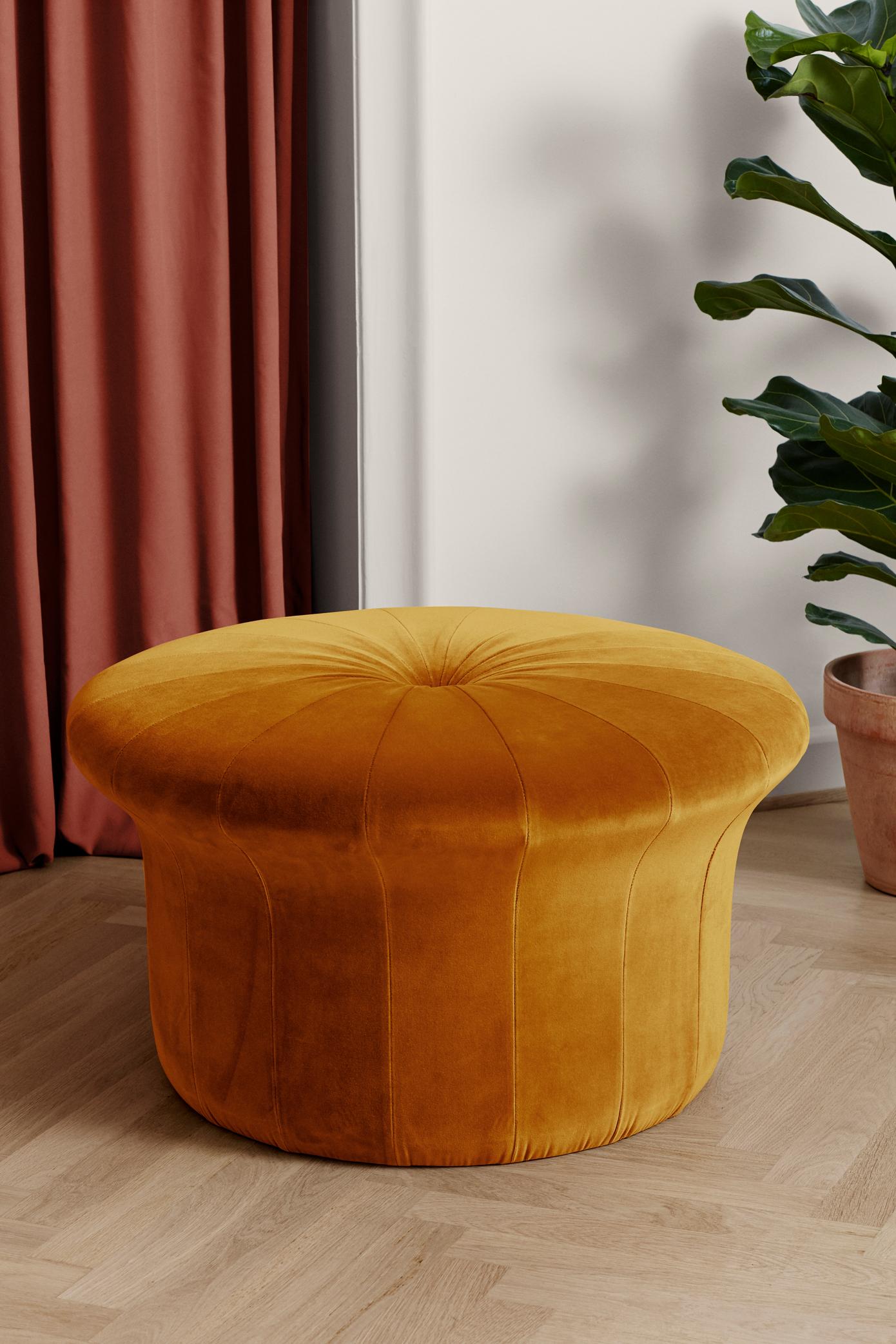 Grace Amber pouf by Warm Nordic
Dimensions: D77 x H 45 cm
Material: Textile upholstery, Foam, Wood.
Weight: 15.5 kg
Also available in different colours and finishes. 

A luxurious pouffe in a sophisticated, inviting idiom, created by the