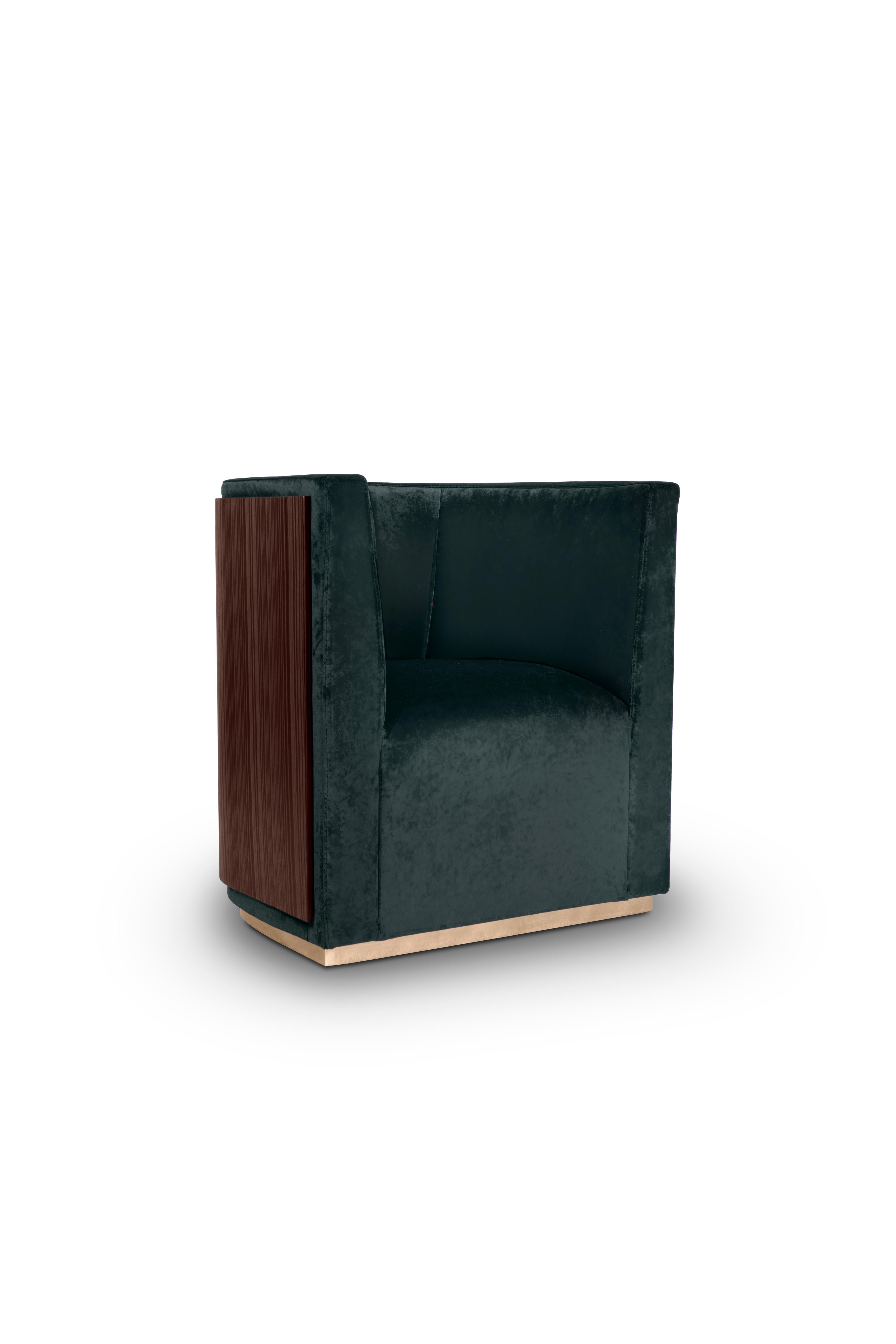 Using a rich velvet upholstery, Grace Armchair has a layered composition, combining a polished brass base with a solid back made of ebony wood, that gives it, somehow, a contrived patina. It is an outstanding piece with a moody and delicate