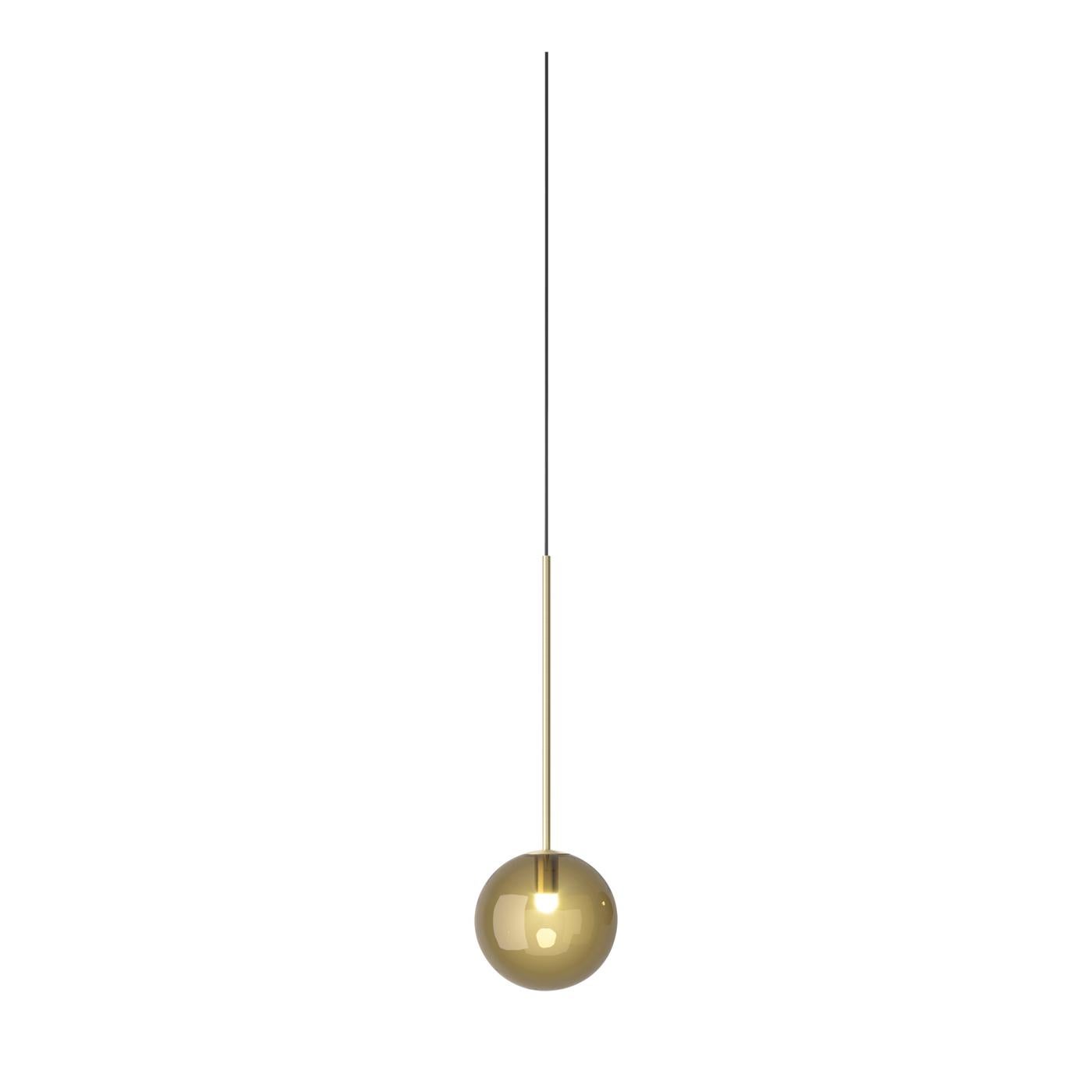 Timeless elegance, simple and meticulous lines obtained by refined and durable materials define this superb pendant lamp. It comprises a long stem (74 cm) crafted of brushed brass, mounted on a ceiling rose (Ø 18 cm) in the same material,