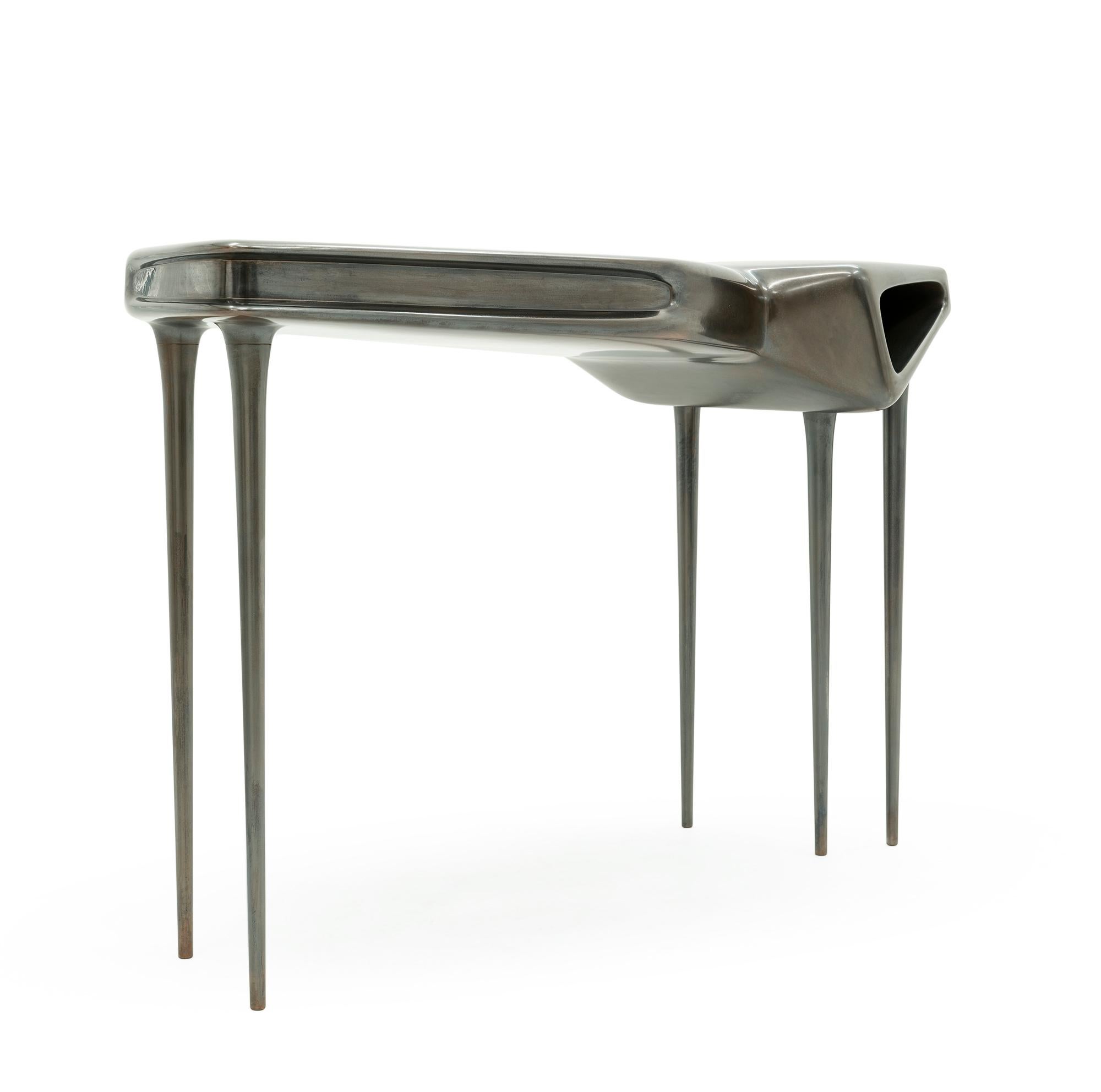 Grace console black - 21st century molded black oxidized carbon metal console

An oxidized carbon copy of the original liquid bronze Grace console, this one is made to be an affinitive accord between human thought and mystical animal, frozen in