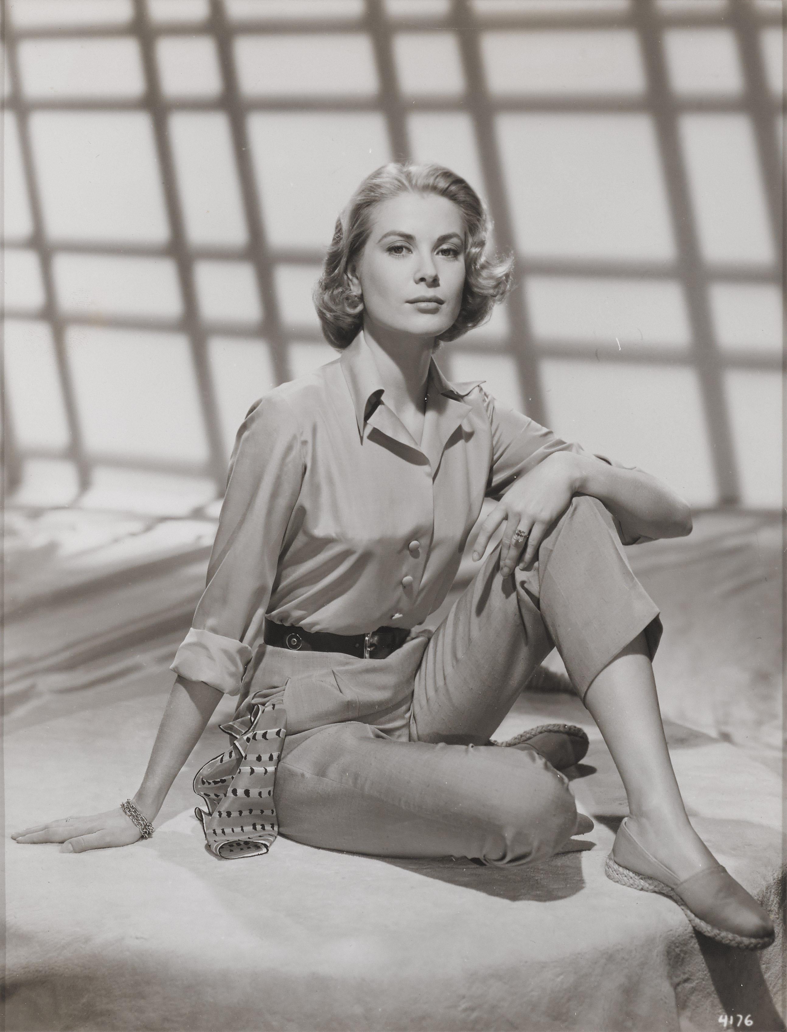 Original photographic MGM glamour fashion portrait of Grace Kelly.
On the reverse of the piece is a stamp with Grace Kelly MGM and a collectors stamp. This information can be seen through the perspex window on the back of the frame.
This piece is
