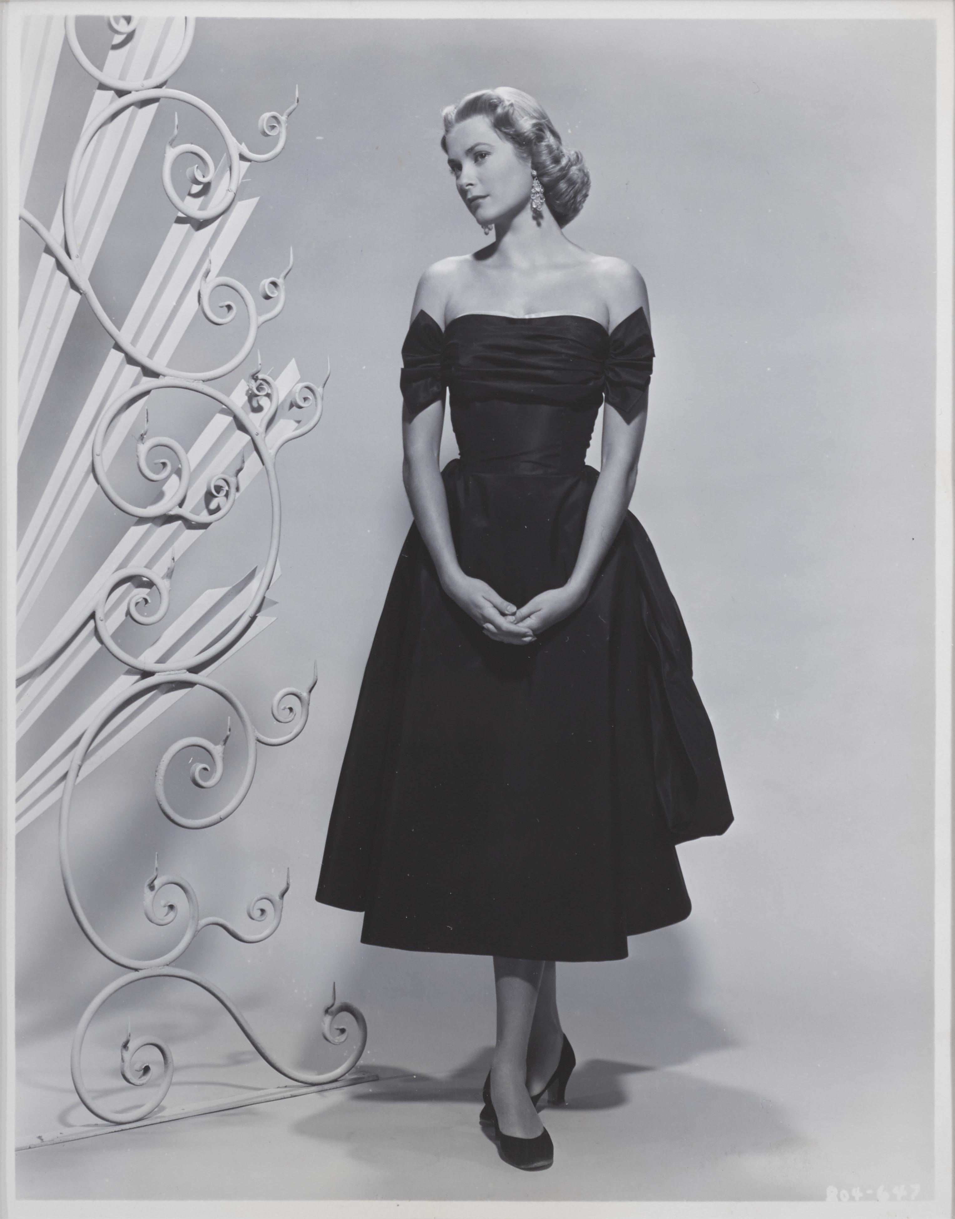 Original Grace Kelly publicity photograph from 1952.
 This production still is conservation framed in an Obeche wood frame with acid free card mounts and UV plexiglass. There is a perspex window on the back of the frame showing information original