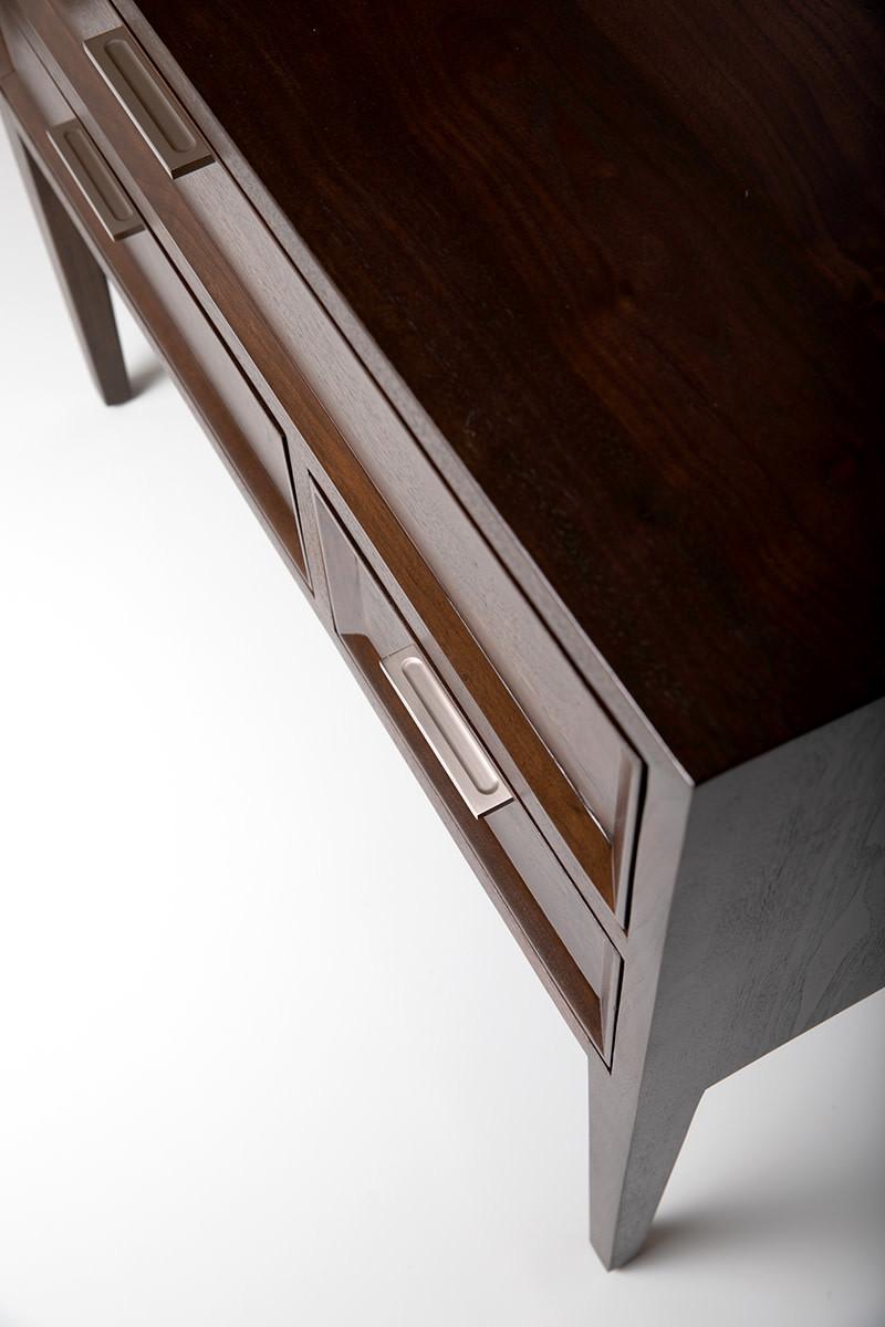 This asymmetrical chest of drawers is scaled to nightstand size at 36”W X 20”D X 30”H. Crafted here in solid walnut with hand lacquered drawer front material, your choice of colors, or choose solid walnut fronts. This piece can also serve as an