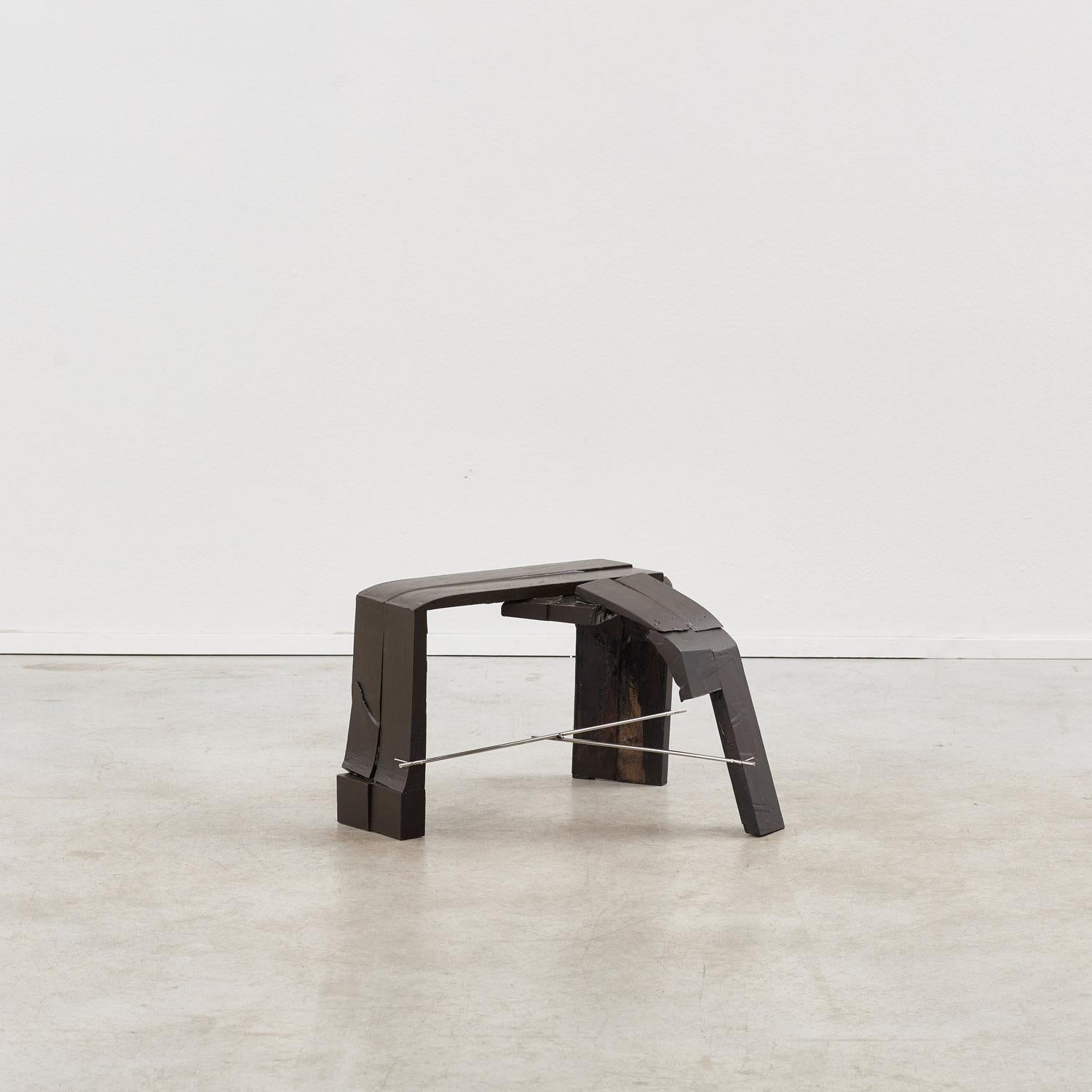 Painted steam-bent wood, fibreglass and polished stainless steel. 

A dialogue between heft and poise is keenly felt in this low stool. Each piece retains a unique identity, fabricated from odd sections of steam-bent waste wood – a chance encounter