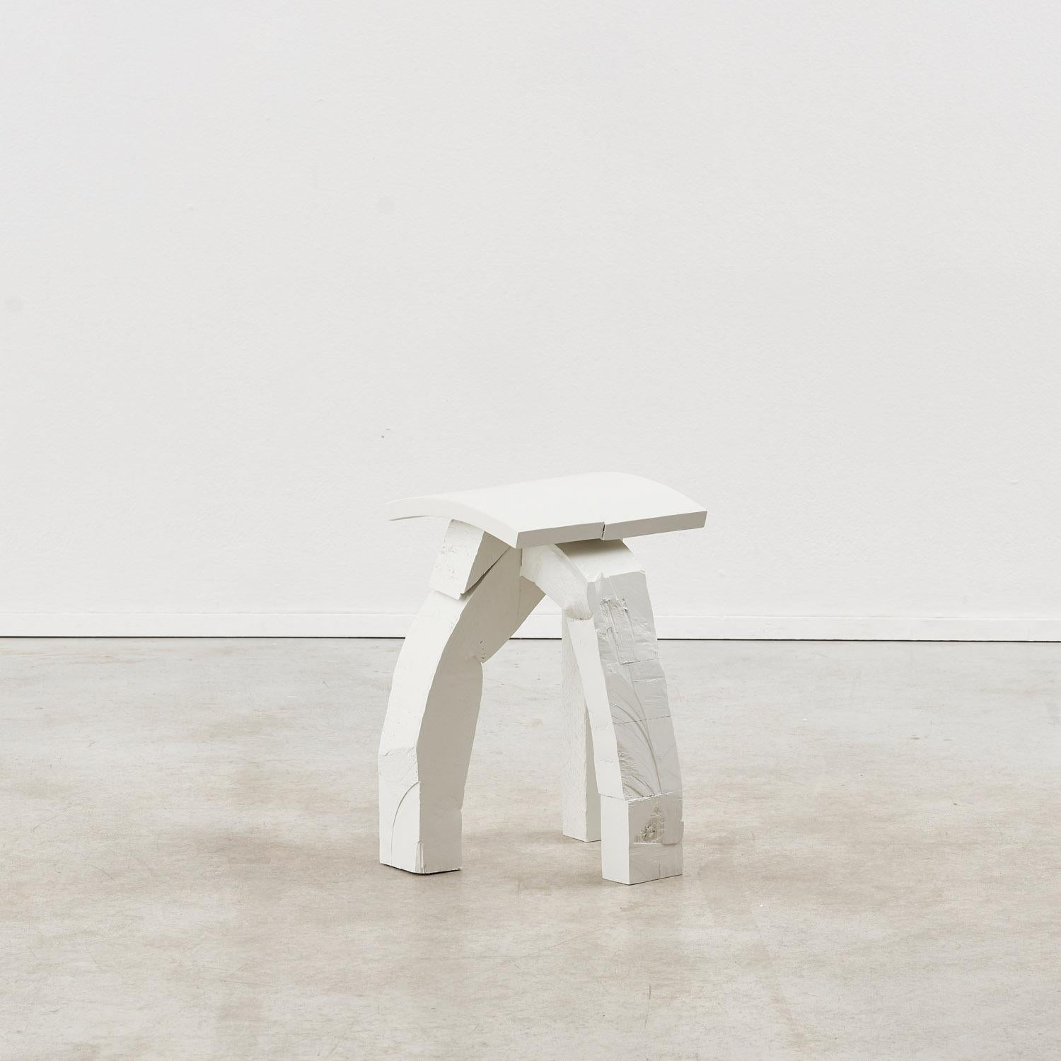 Painted steam-bent wood. 

Almost animalian in its expression, this stool is crafted from steam-bent waste wood, rendering each in the edition unique. Below a curved split seat, two roughly-hewn legs are held in composition with a more conventional