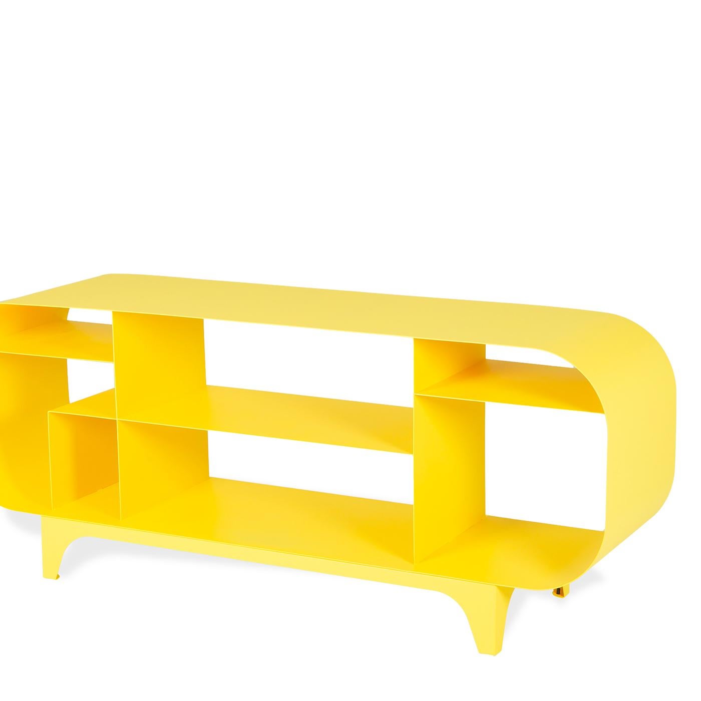 Defined by bold curves and smooth, geometric lines, this exceptional console is crafted of steel sheets in a vivid yellow color and boasts a minimalist design with an elongated oval frame and three shelves arranged at different heights. Combining
