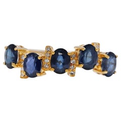 Bague gracieuse en or jaune 18 carats avec saphir bleu de 0,68 carat et diamants naturels