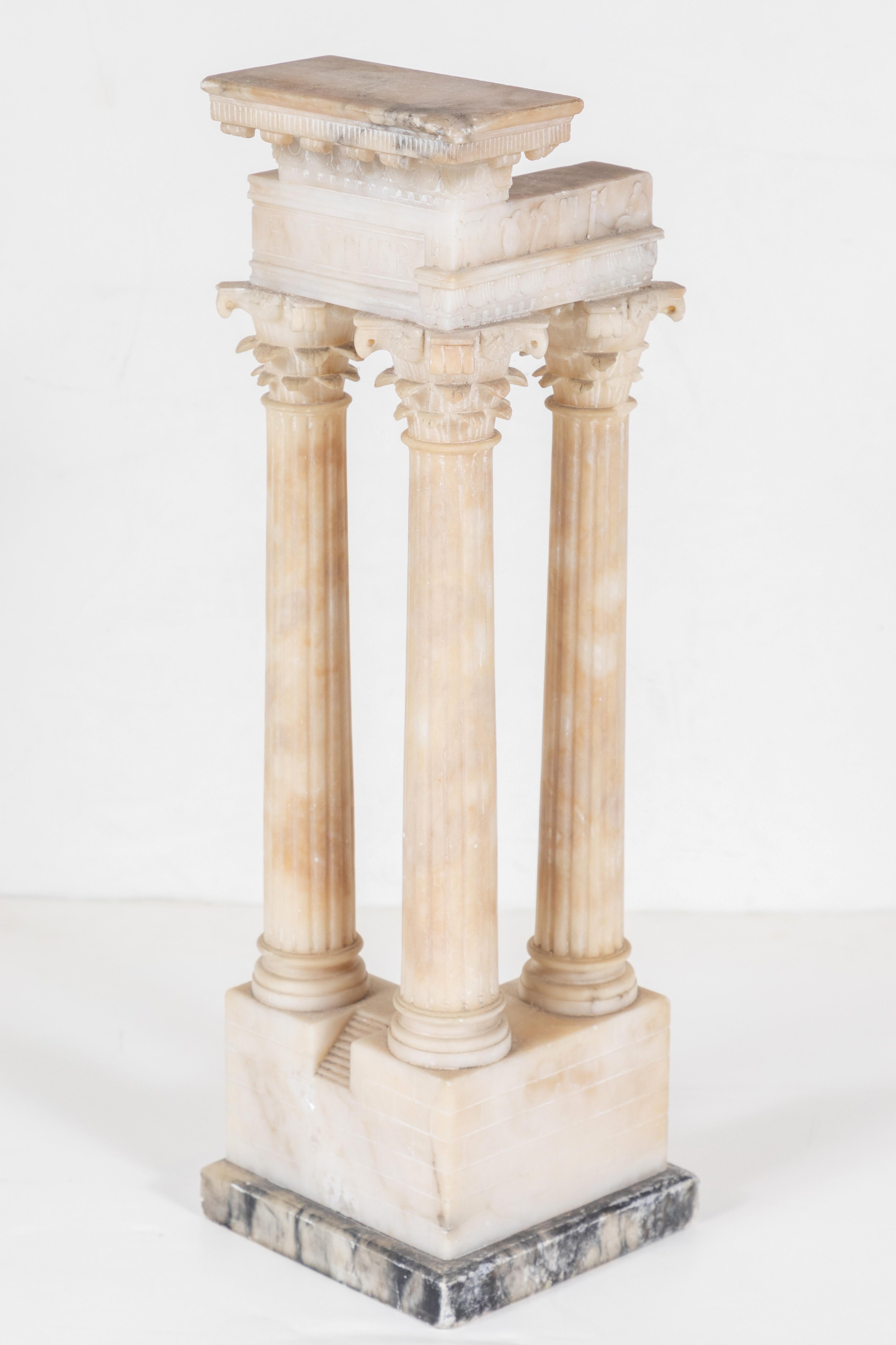 Beautifully carved, Grand Tour period architectural model featuring fluted columns surmounted by Corinthian capitals and a relief carved pediment above a raised base inset with a flight of steps.