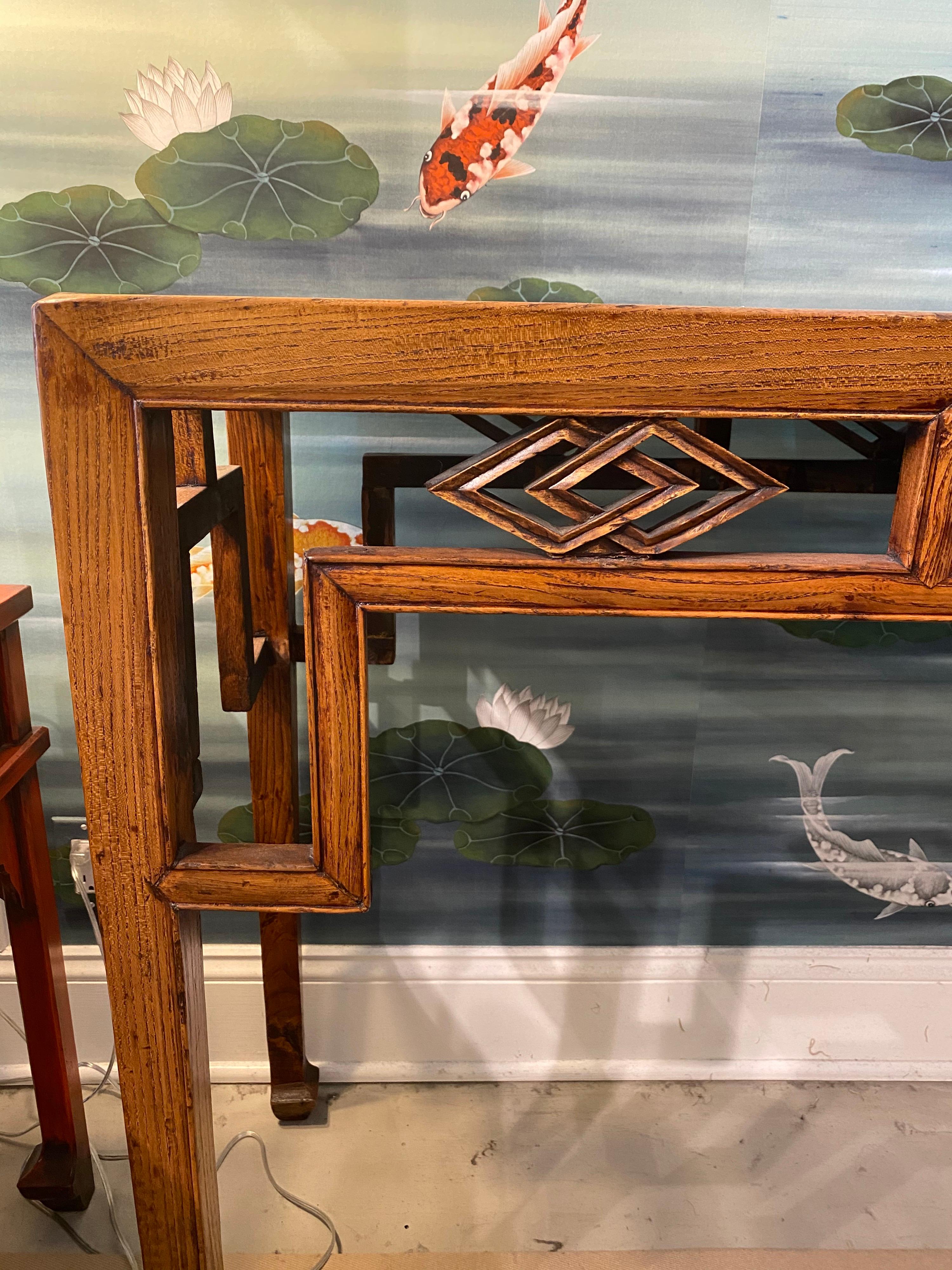 A wonderful console/altar table, perfect for behind a sofa or in an entry hall or dining room.

This is elmwood, and he apron has a fantastic geometric pattern.