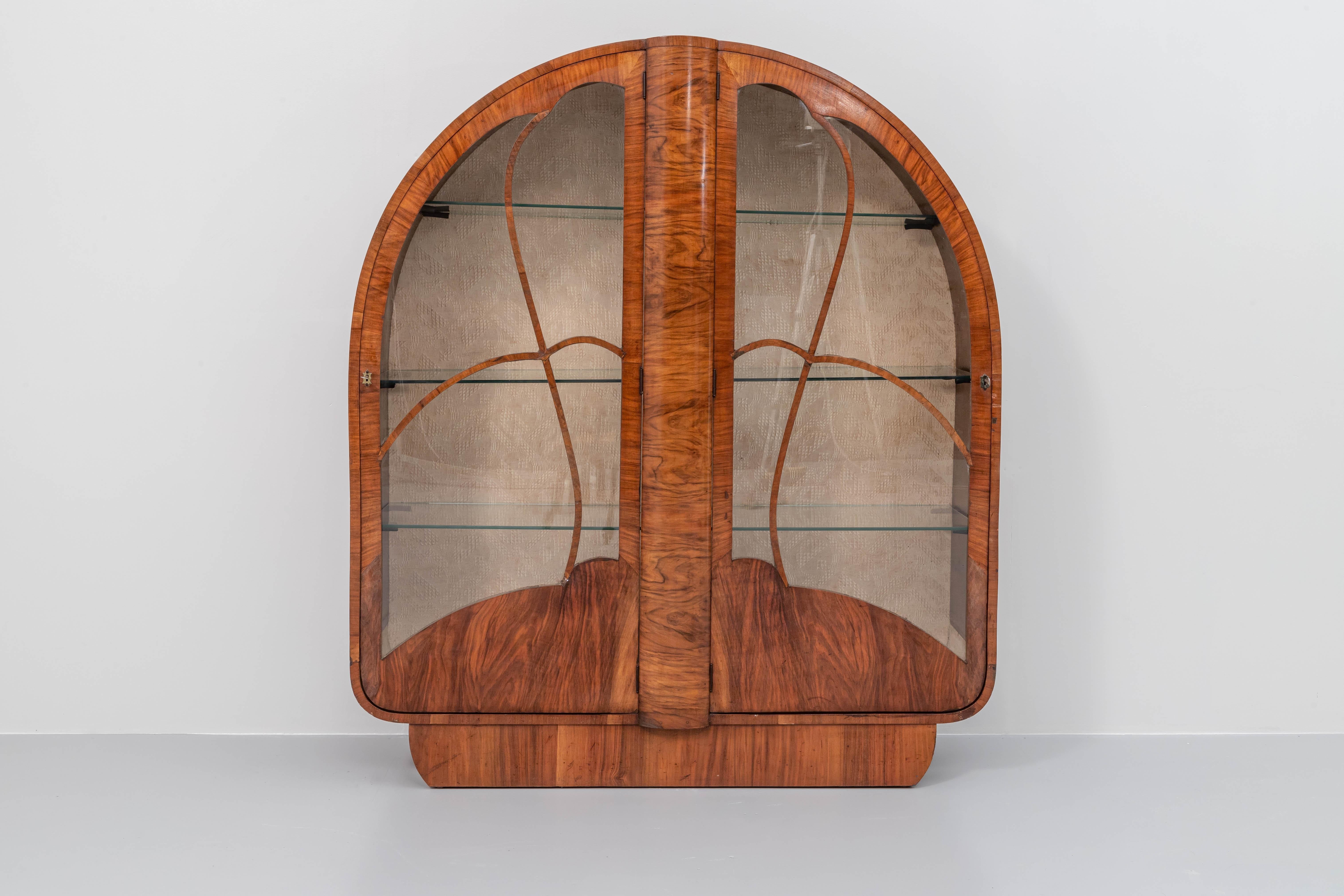 Graceful and elegant french Art Deco cabinet more than a century old. The shapes and the colour of the wood really stand out in this phenomenal piece of craftsmanship. A lot of time and effort must have gone into this project if you look at how