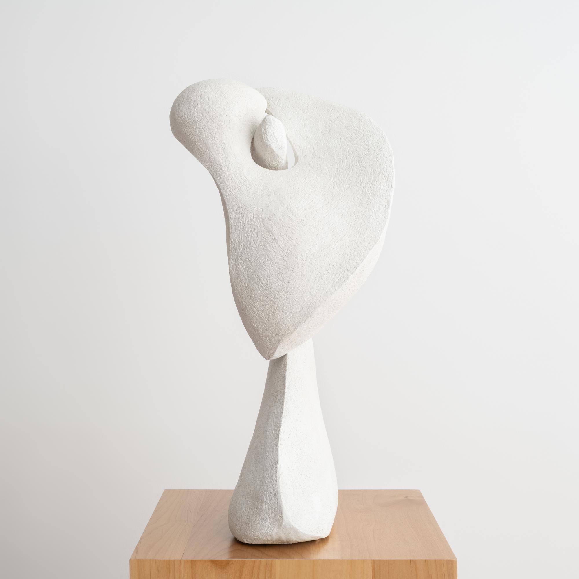 'Calla Lily' by Simone-Bodmer Turner is a contemporary white ceramic sculpture that gracefully blends the realms of biomorphism and abstraction.  Standing 24-inches tall, with a 12-inch diameter at its widest point and 6-inches at the base, this