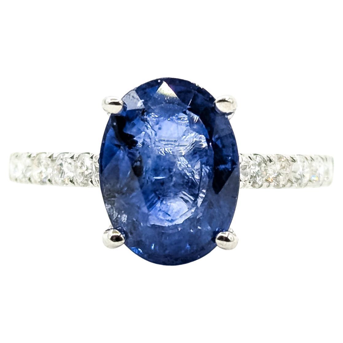 Gracieuse bague de fiançailles en or blanc 18k avec saphir de Ceylan et diamant