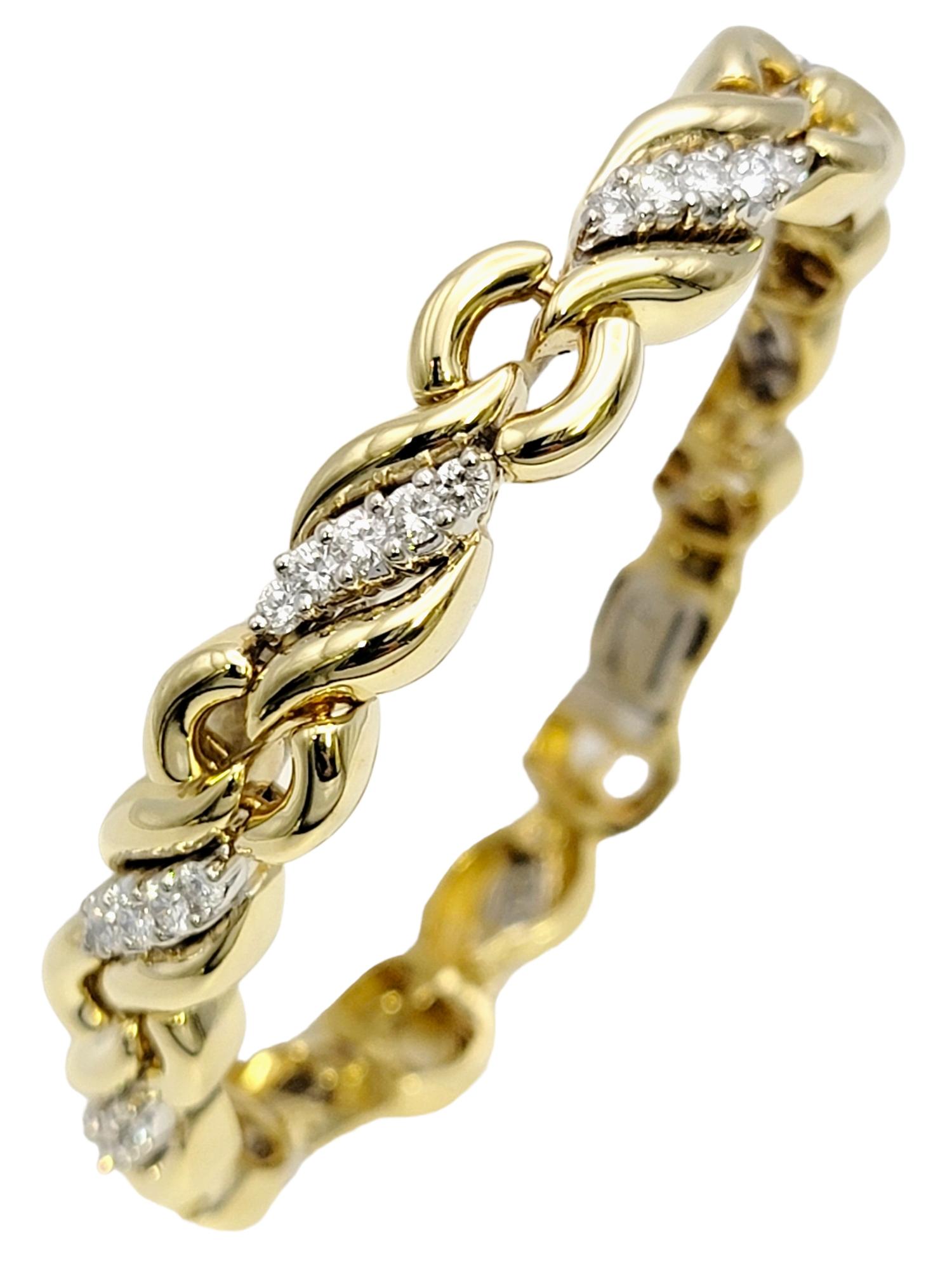 Length: 6.75 Inches

Indulge in the beauty of this captivating diamond wave link bracelet, expertly crafted in two-tone 18K white and yellow gold. This exquisite piece of jewelry showcases a harmonious blend of elegance and sophistication, making it