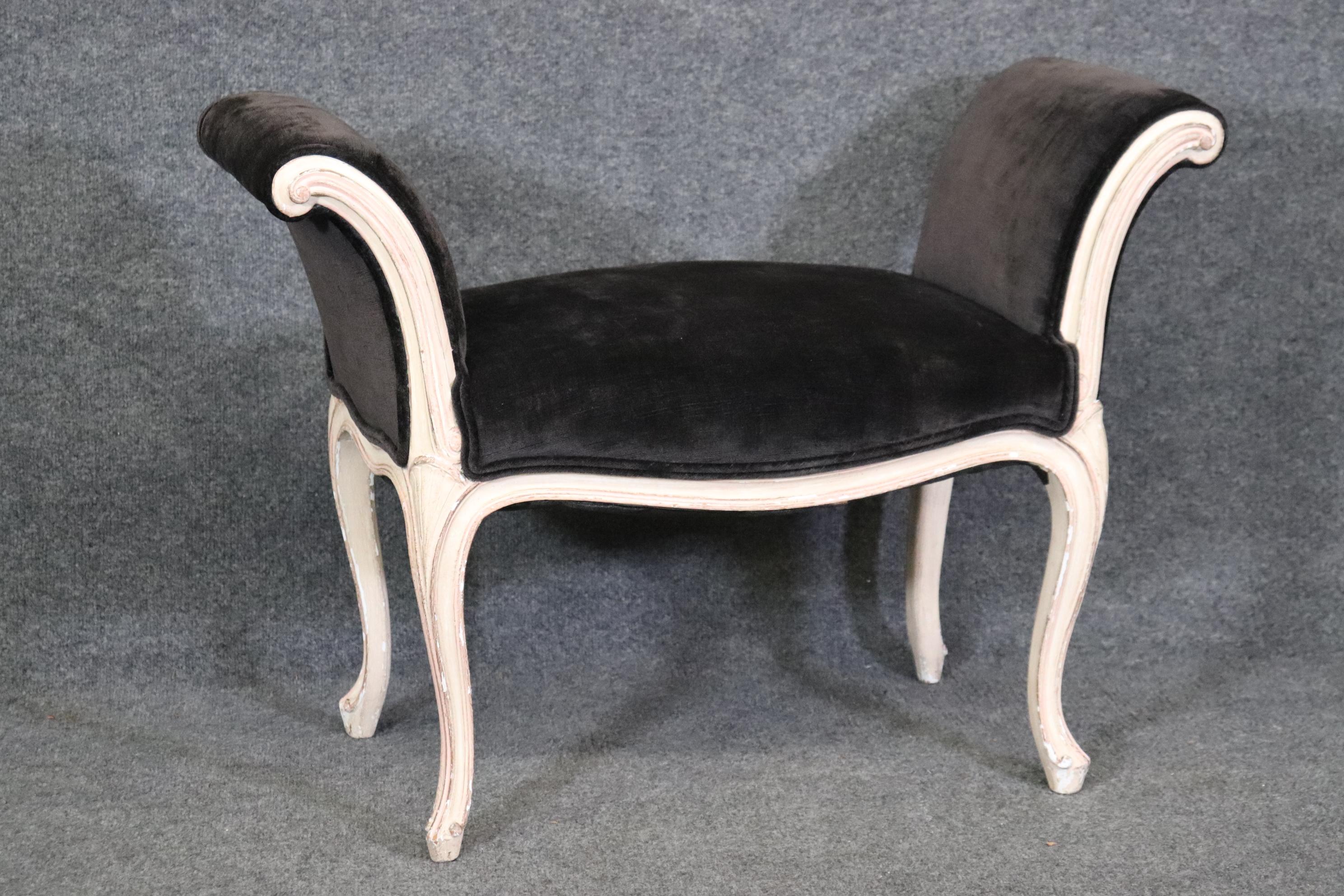 This is a gorgeous and graceful stool. The black velvet contrasts beautifully with the white distressed frame. There is one small stain shown but its dark too so not obvious. Measures 25 tall x 34 wide x 18.25 deep seat height 18.25 and dates to the