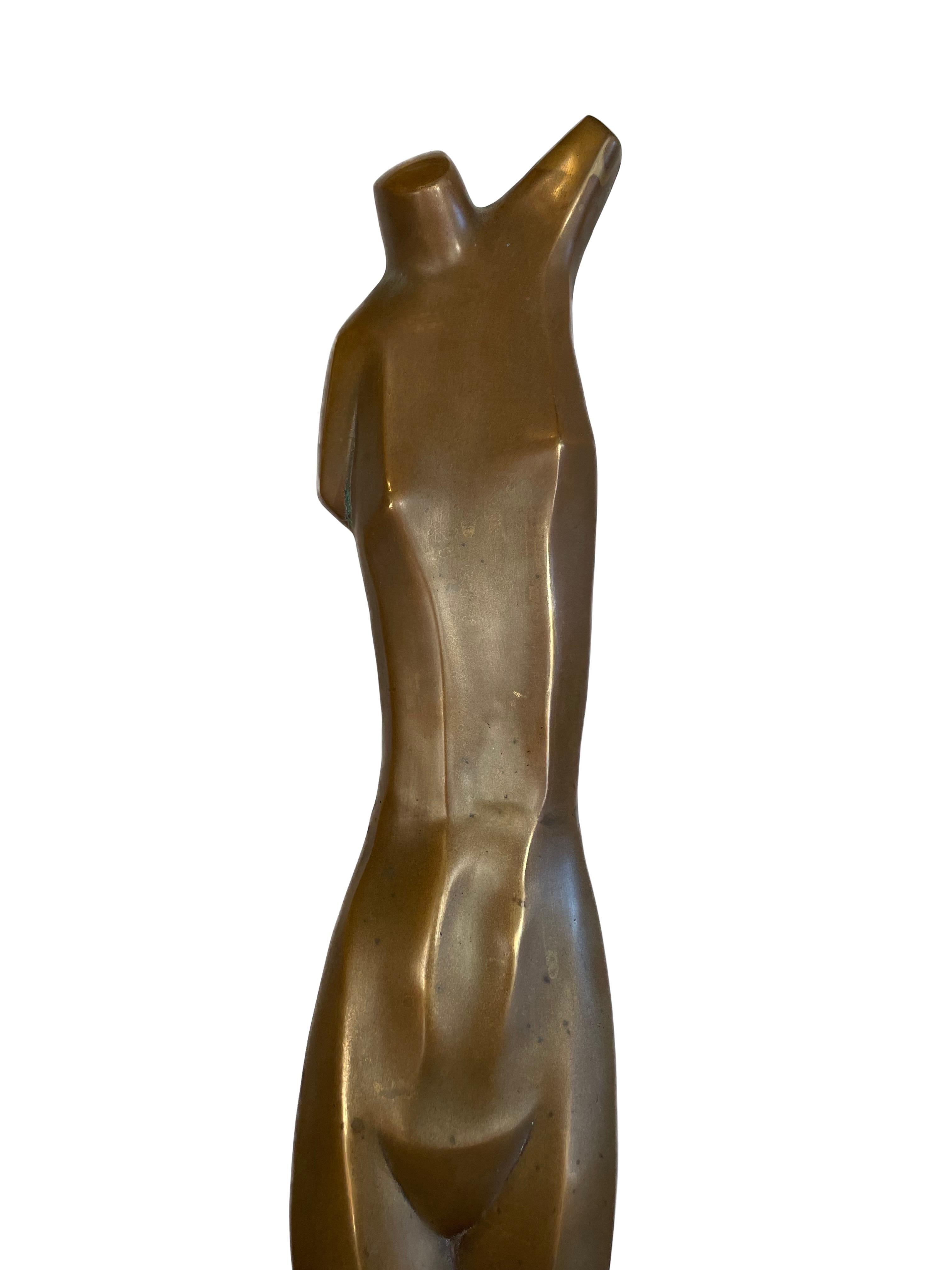 Sleek bronze sculpture of a nude figure. 
This sculpture of an elongated torso made of hollow but thick bronze, standing on an attached bronze base.
 