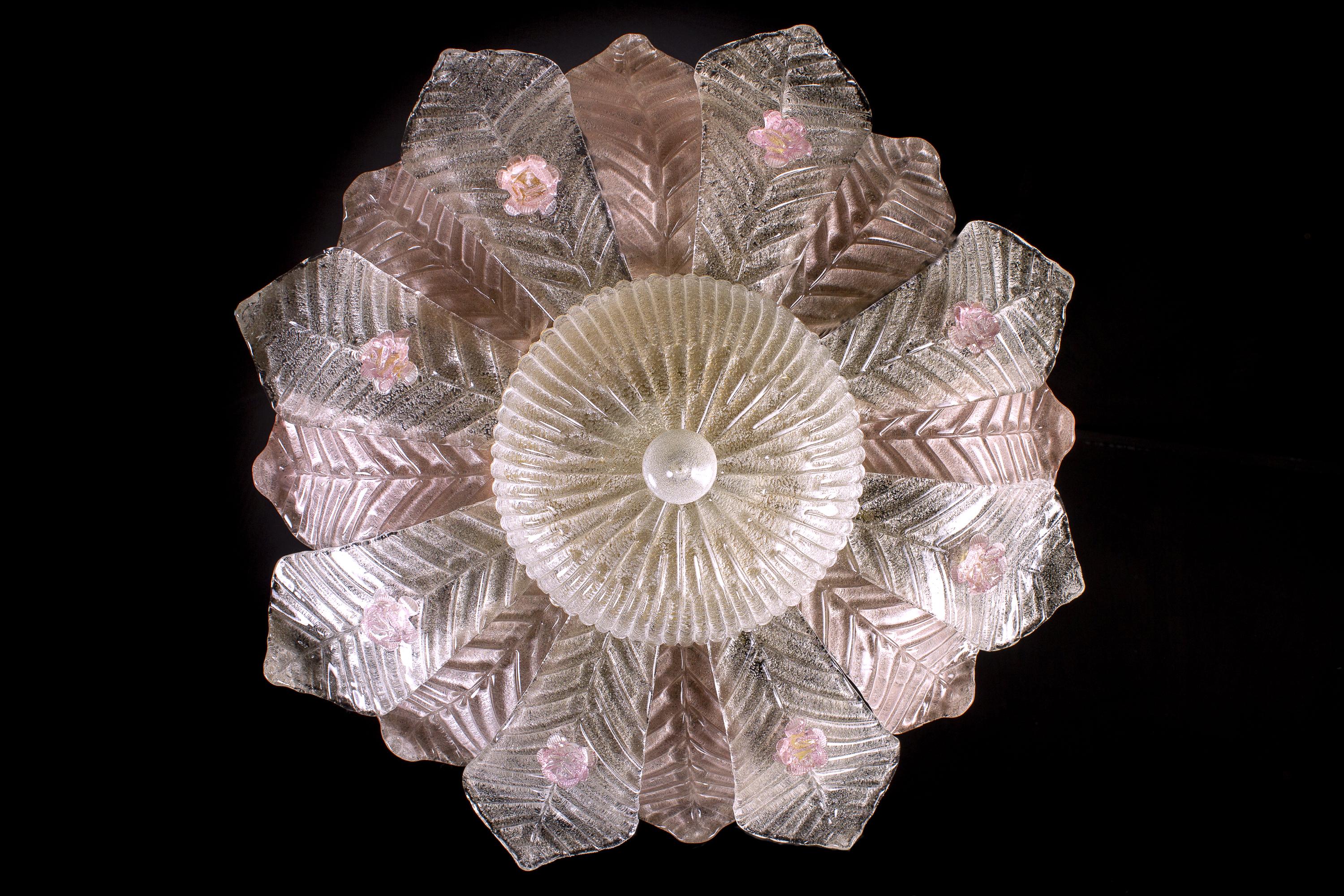 Amazing Barovier & Toso attributed Murano glass ceiling light, made of precious hand blown pink, ice leaves glasses with golden inclusion, embellished with delicious pink roses. Has the look of a precious big flower.
Cleaned and re-wired, in full