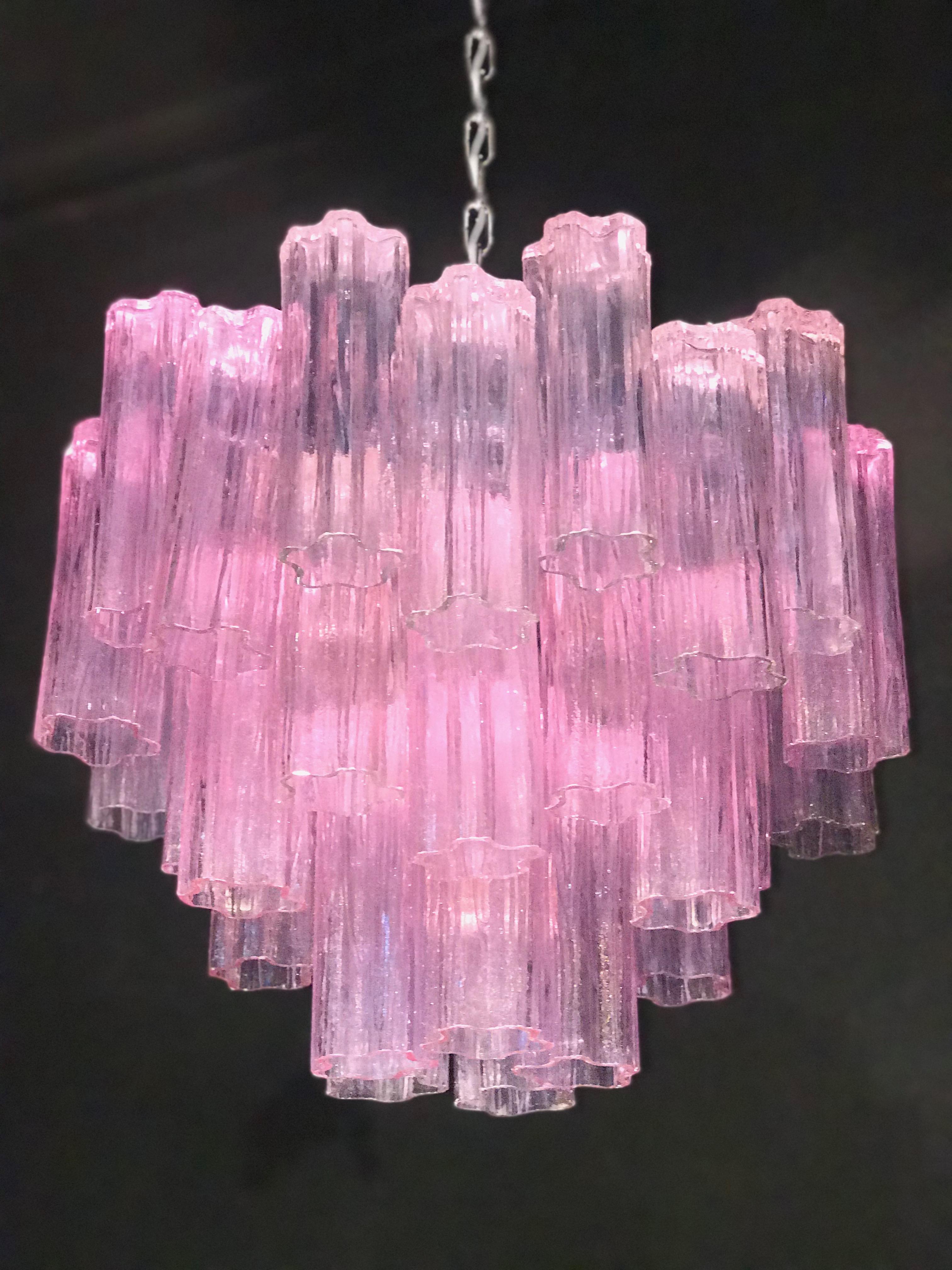 This amazing chandelier includes precious pink tronchi Murano glasses 20 cm long.
Nickel-plated metal structure on three levels,
Perfect vintage condition.
Seven E 27 light bulbs wired for US standards.
Available 8 chandeliers and 4 pairs of
