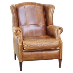 Graziosa, elegante e confortevole sedia ad ala in pelle di mucca in stile inglese