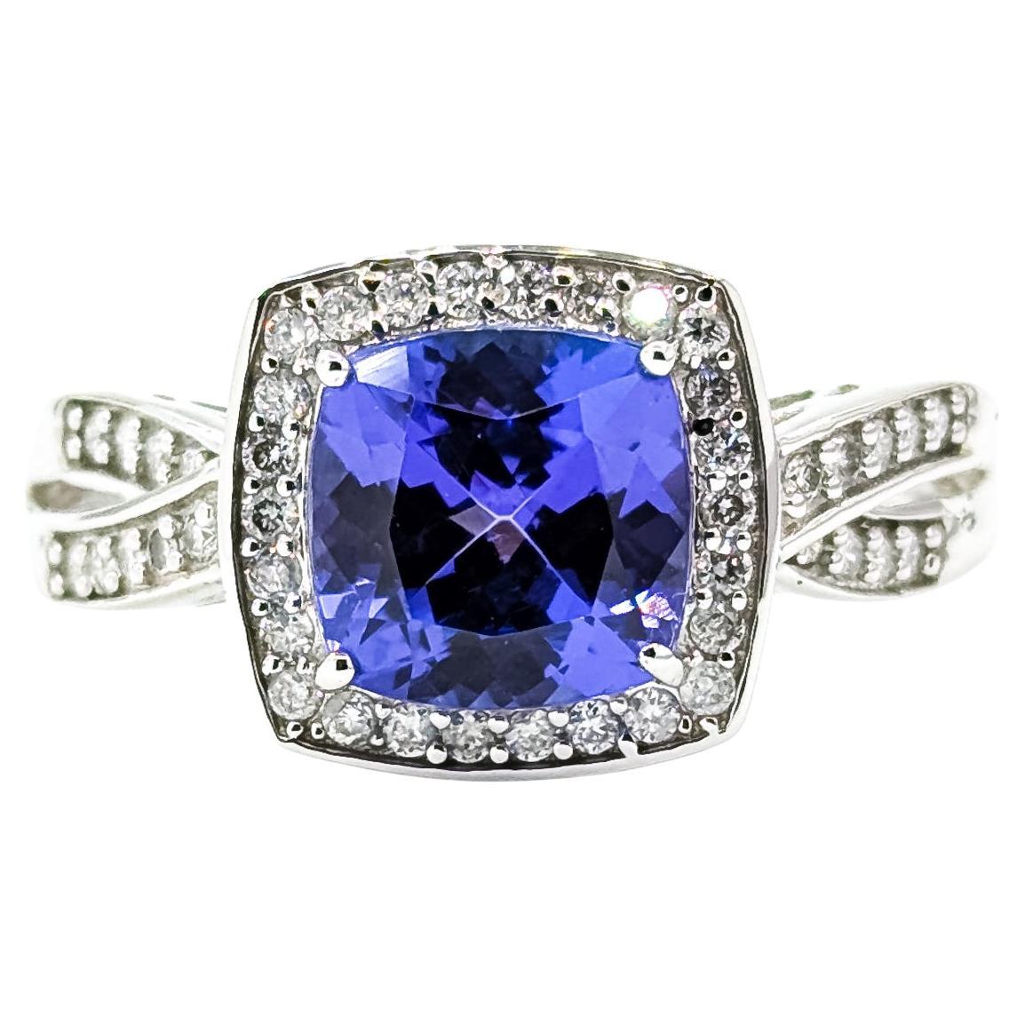 Grazioso anello a raggiera con tanzanite e diamanti in 14 carati