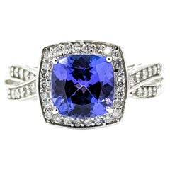 Graceful Tanzanite & Diamond Halo Ring in 14k