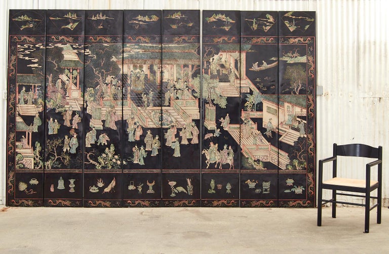 Rare, bespoke lacquered eight-panel coromandel screen made in the Ming Dynasty style by Gracie Studio artisans in New York. Modern custom-made coromandel screen purchased from Gracie features thick, smooth panels of black lacquer intricately incised