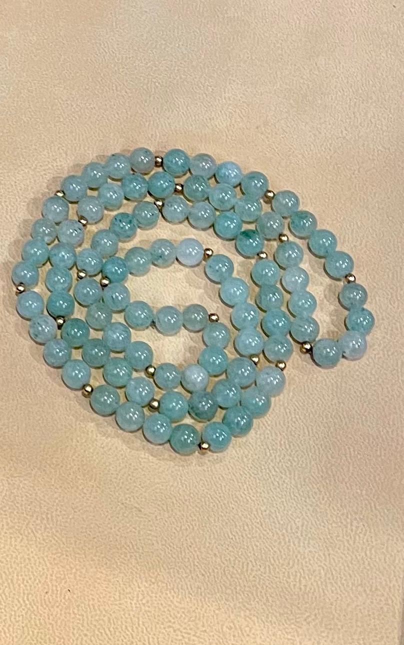 
Grade A++ Green  Quartz Crystal Bead Necklace 8.5 mm, Genuine Gemstone and has 14 Karat gold beads in between.
length 28 inches 
19 gold beads
no Clasp
Weight of the necklace is 68 grams
I guaranteed you will be very happy .
Super fashionable and