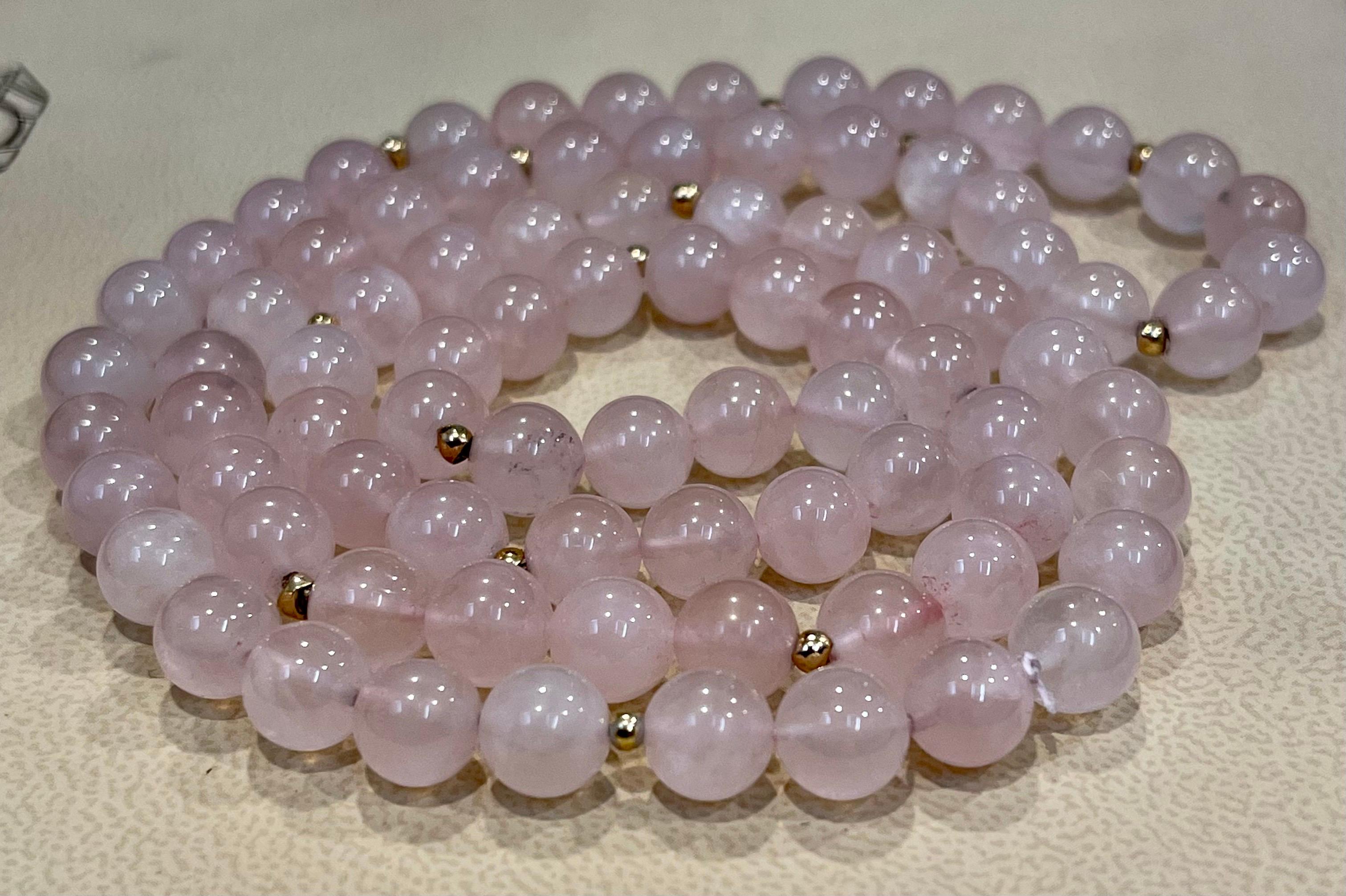 
Grade A++ Rose Quartz Crystal Bead Necklace 8.5 mm, Genuine Gemstone and has 14 Karat gold beads in between.
length 28 inches 
19 gold beads
no Clasp
Weight of the necklace is 68 grams
I guaranteed you will be very happy .
Super fashionable and