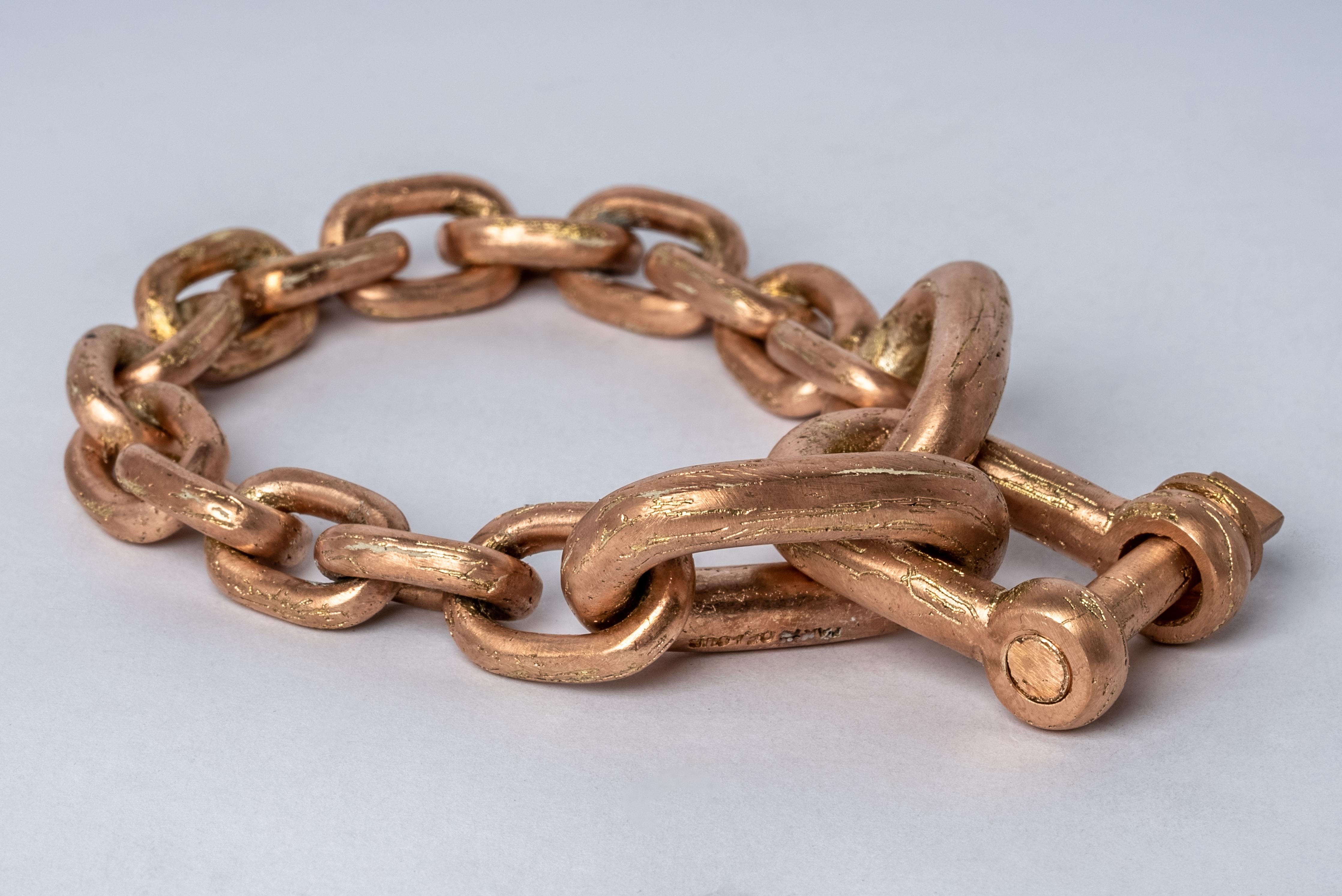 Chain charm bracelet made in brass. Brass substrate is electroplated with 18k Rose Gold and then dipped into acid to create the subtly destroyed surface. The Charm System is an interrelated group of products that can be mixed and matched or worn